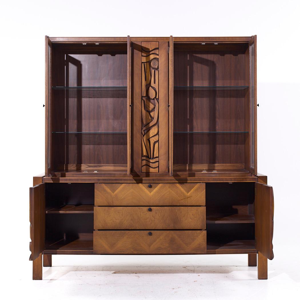 United Mid Century Tiki Walnut Credenza and Hutch

The credenza measures: 74.25 wide x 20.25 deep x 32.25 inches high
The hutch measures: 68 wide x 15 deep x 45.5 inches high
The combined height of the credenza and hutch is 77.75 inches

All pieces