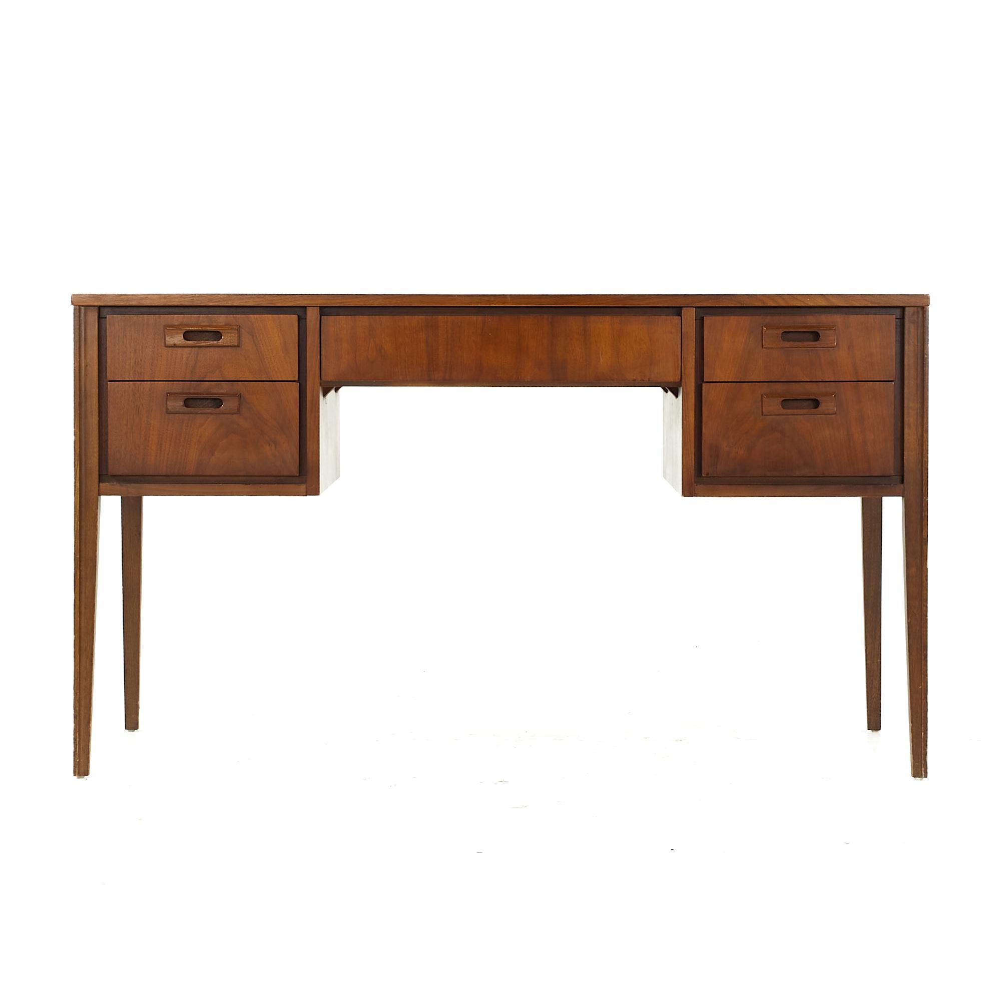 United midcentury walnut and leather top desk

This desk measures: 52 wide x 24 deep x 29.5 high, with a chair clearance of 24 inches

All pieces of furniture can be had in what we call restored vintage condition. That means the piece is