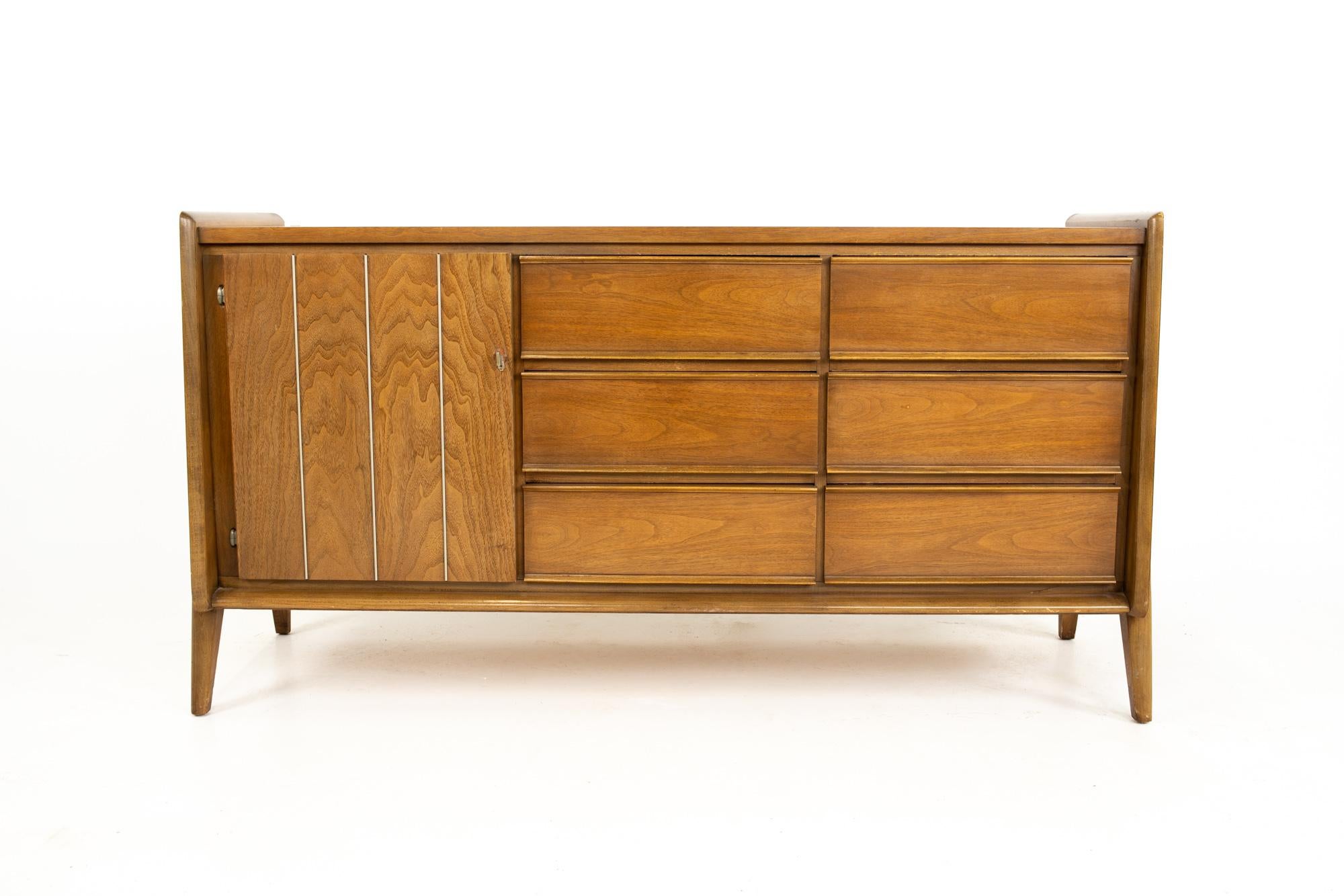 United Mid Century walnut 9-drawer lowboy dresser
Dresser measures: 60 wide x 19.5 deep x 32.5 inches high

All pieces of furniture can be had in what we call restored vintage condition. This means the piece is restored upon purchase so it’s free of