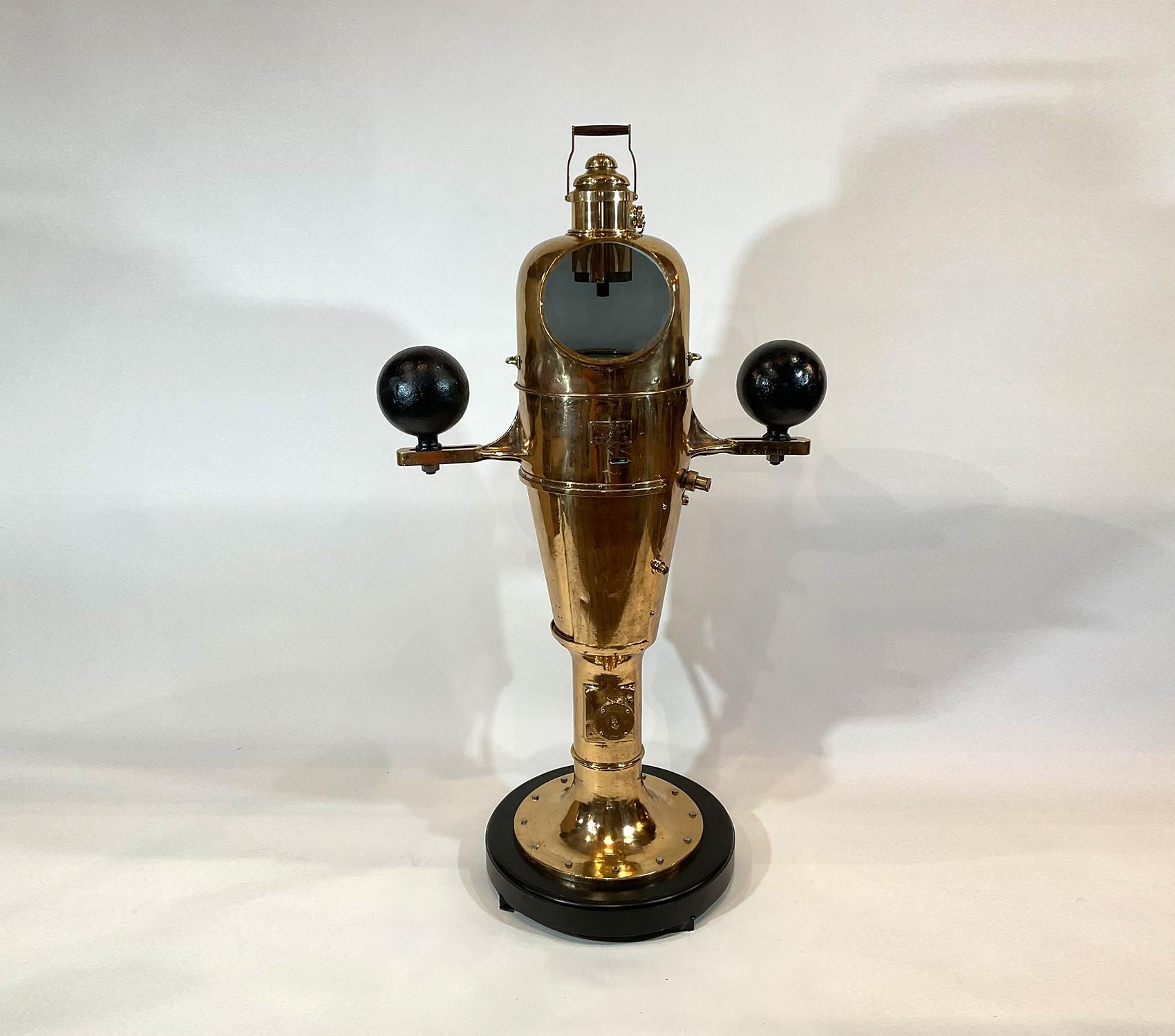 Immense three-hundred-pound ships binnacle compass with highly polished and lacquered finish. With maker’s plate from Lionel Corp. With the rarely found top light that is complete with handle and top vent. The base is complete with sliding door,