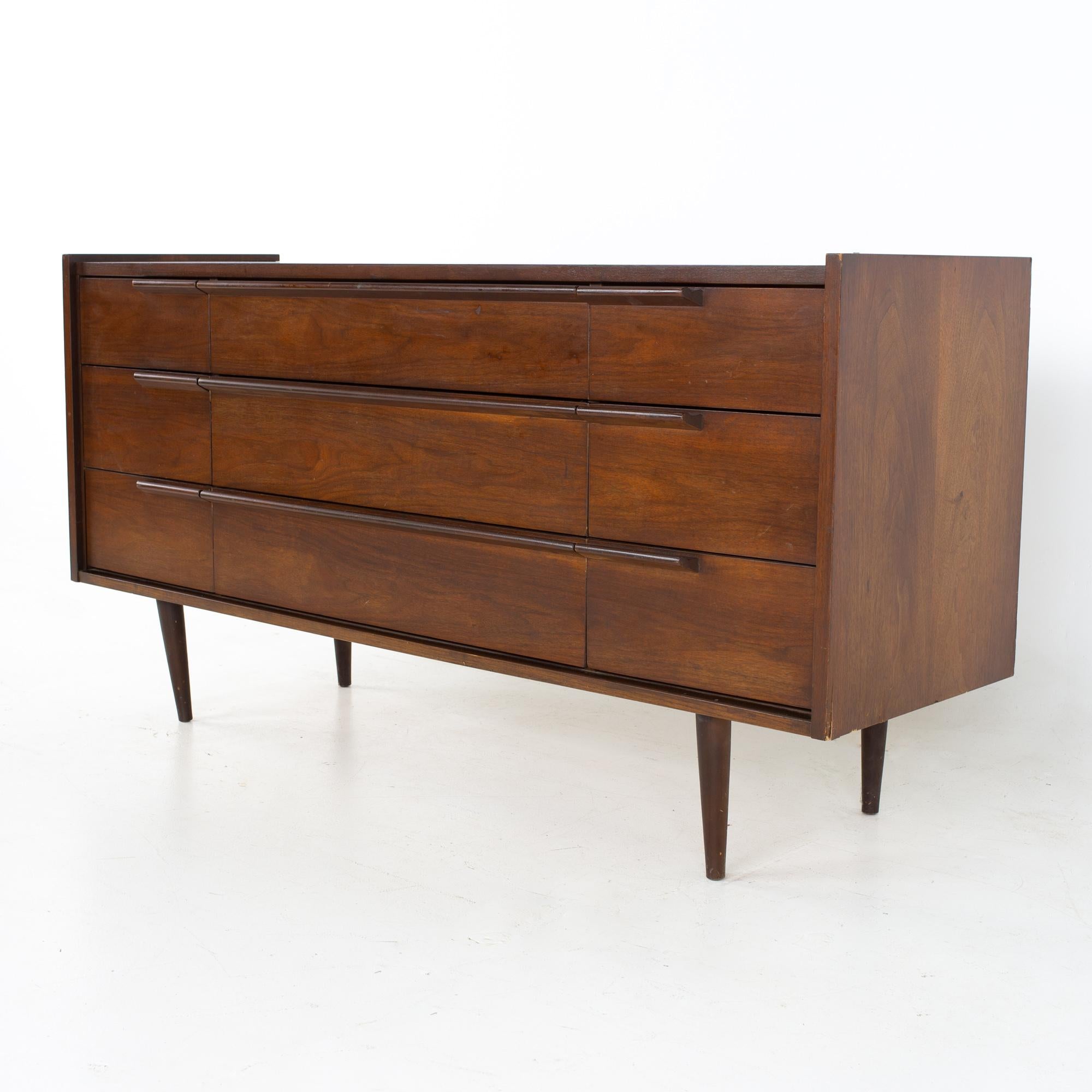 United style mid century walnut 9 drawer lowboy dresser
Dresser measures: 60 wide x 18.5 deep x 31 inches high

All pieces of furniture can be had in what we call restored vintage condition. That means the piece is restored upon purchase so it’s