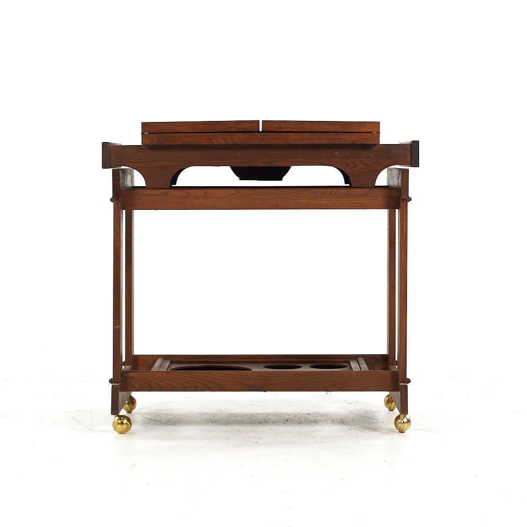 United Style Mid Century Walnut Bar Cart

This bar cart measures: 32 wide x 19 deep x 31.5 inches high, each flip top shelf measures 8 inches wide, making a maximum bar cart width of 48 inches when both flip shelves are engaged

All pieces of