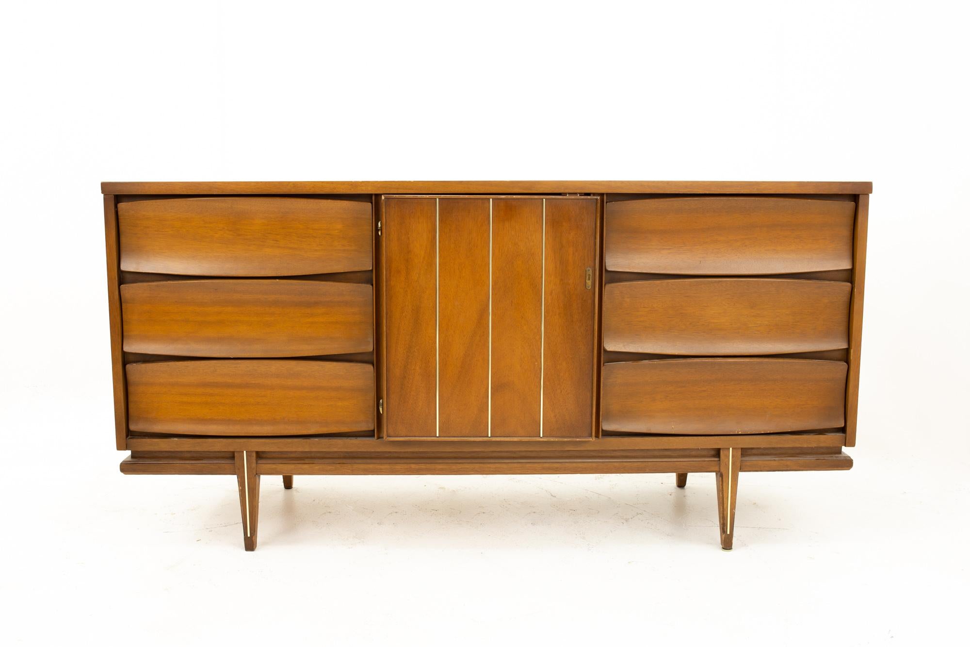 United style Mid Century 9-drawer walnut dresser
Dresser measures: 62 wide x 19 deep x 31 high

This price includes getting this piece in what we call restored vintage condition. That means the piece is permanently fixed upon purchase so it’s free