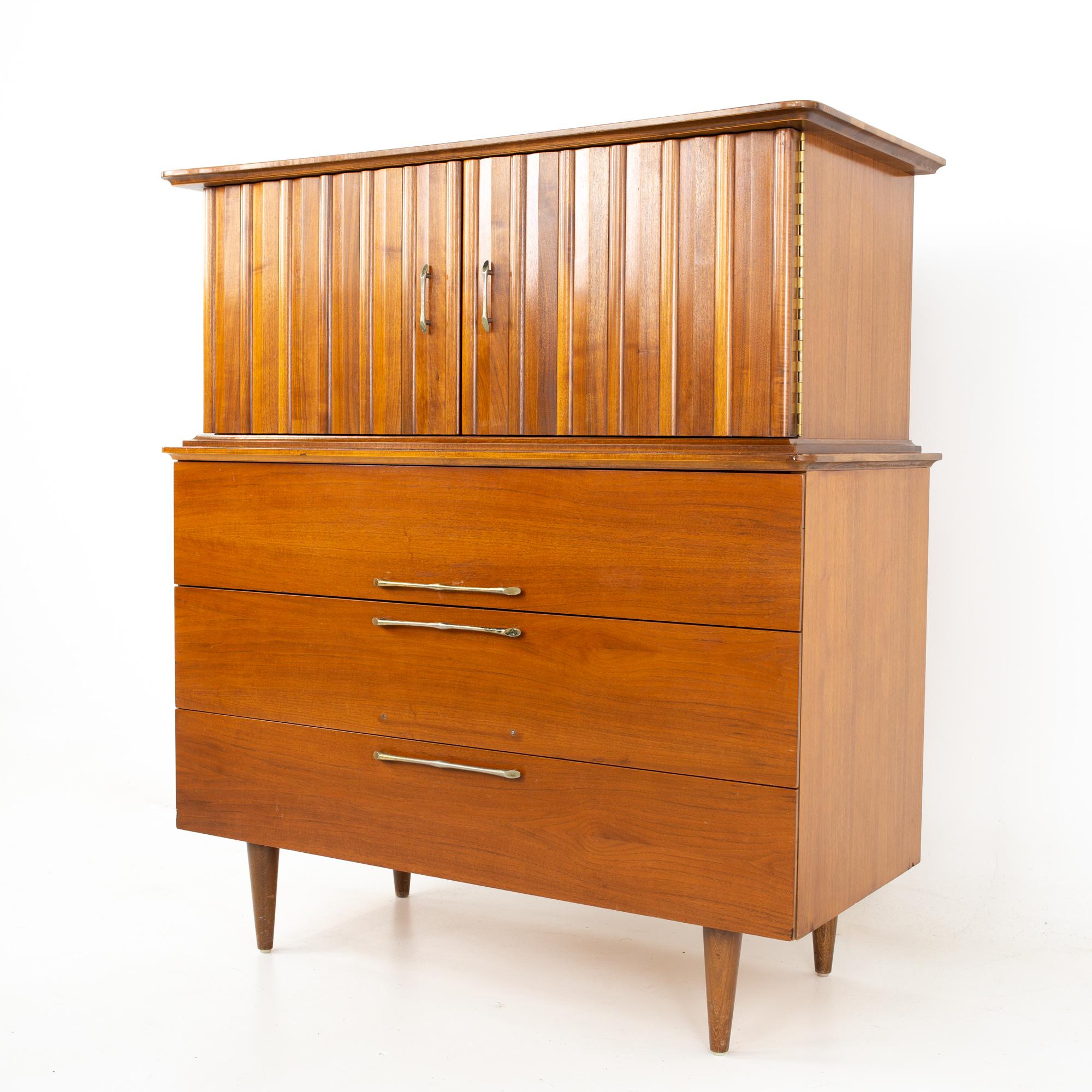 United style young manufacturing midcentury walnut and brass gentleman's chest highboy dresser
Dresser measures: 42 wide x 19 deep x 46.75 inches high

All pieces of furniture can be had in what we call restored vintage condition. That means the