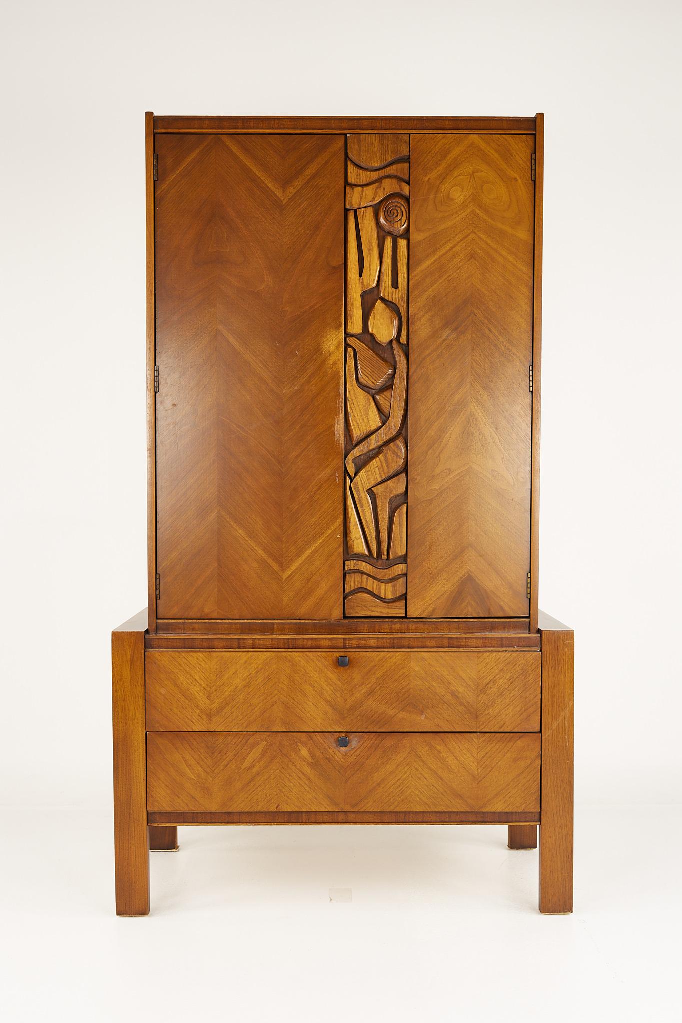 United Tiki Brutalist mid century walnut armoire gentlemans chest

This armoire measures: 40.75 wide x 20.25 deep x 71.25 inches high

?All pieces of furniture can be had in what we call restored vintage condition. That means the piece is