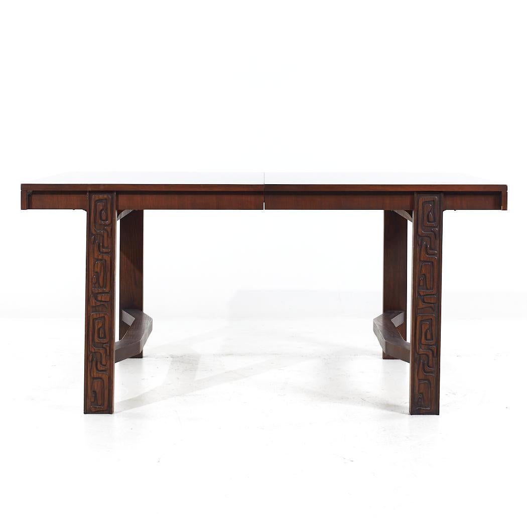 United Tiki Brutalist Mid Century Walnut Expanding Dining Table with 2 Leaves

This table measures: 62.25 wide x 42 deep x 29.75 inches high, with a chair clearance of 26.25 inches, each leaf measures 18 inches wide, making a maximum table width of