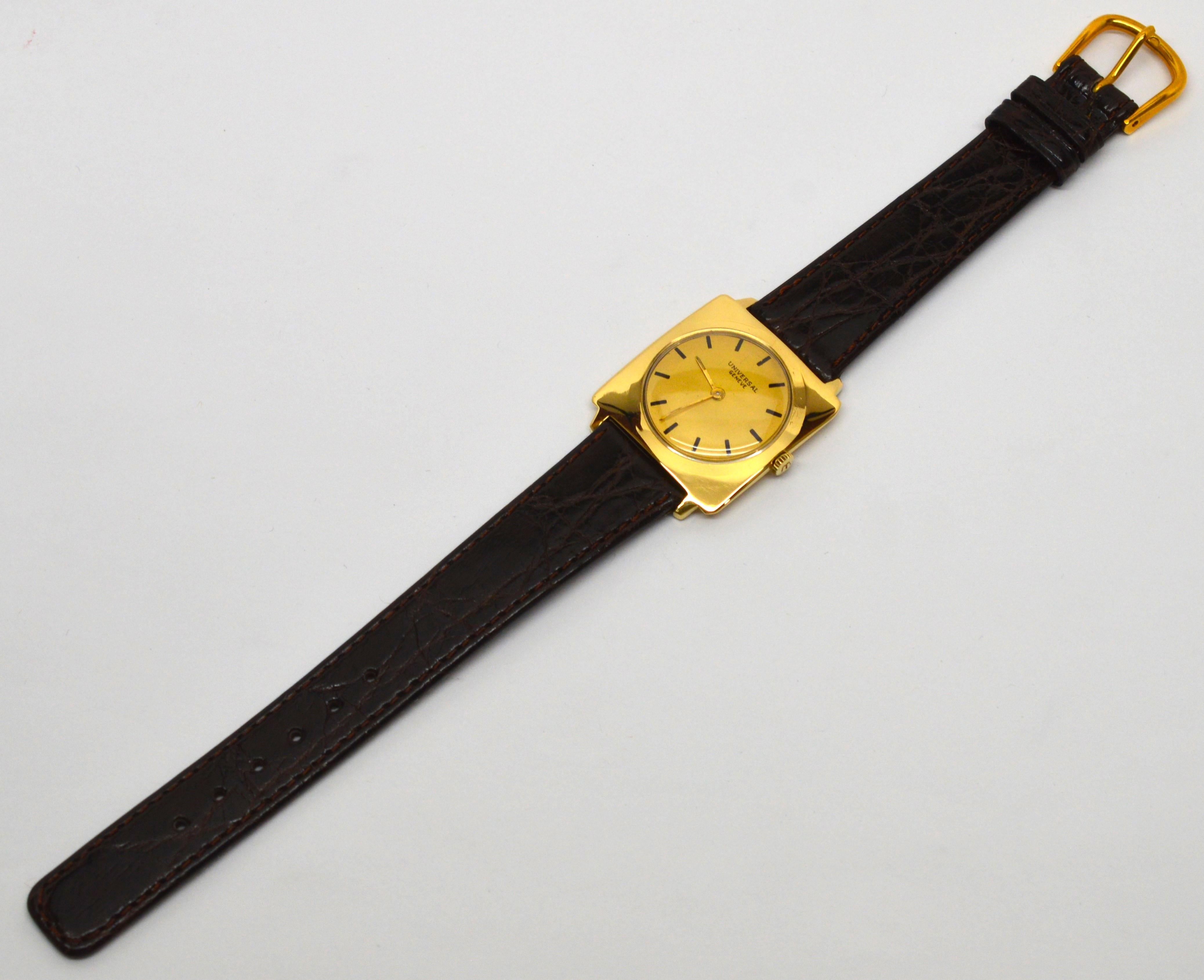 Smart looking with a square case made of 18K yellow gold, this unusual vintage Universal Men's Wrist Watch is a unique addition to one's coveted watch collection. With simple elegance, this circa late '40's  square case (no. 18203-1) measures a