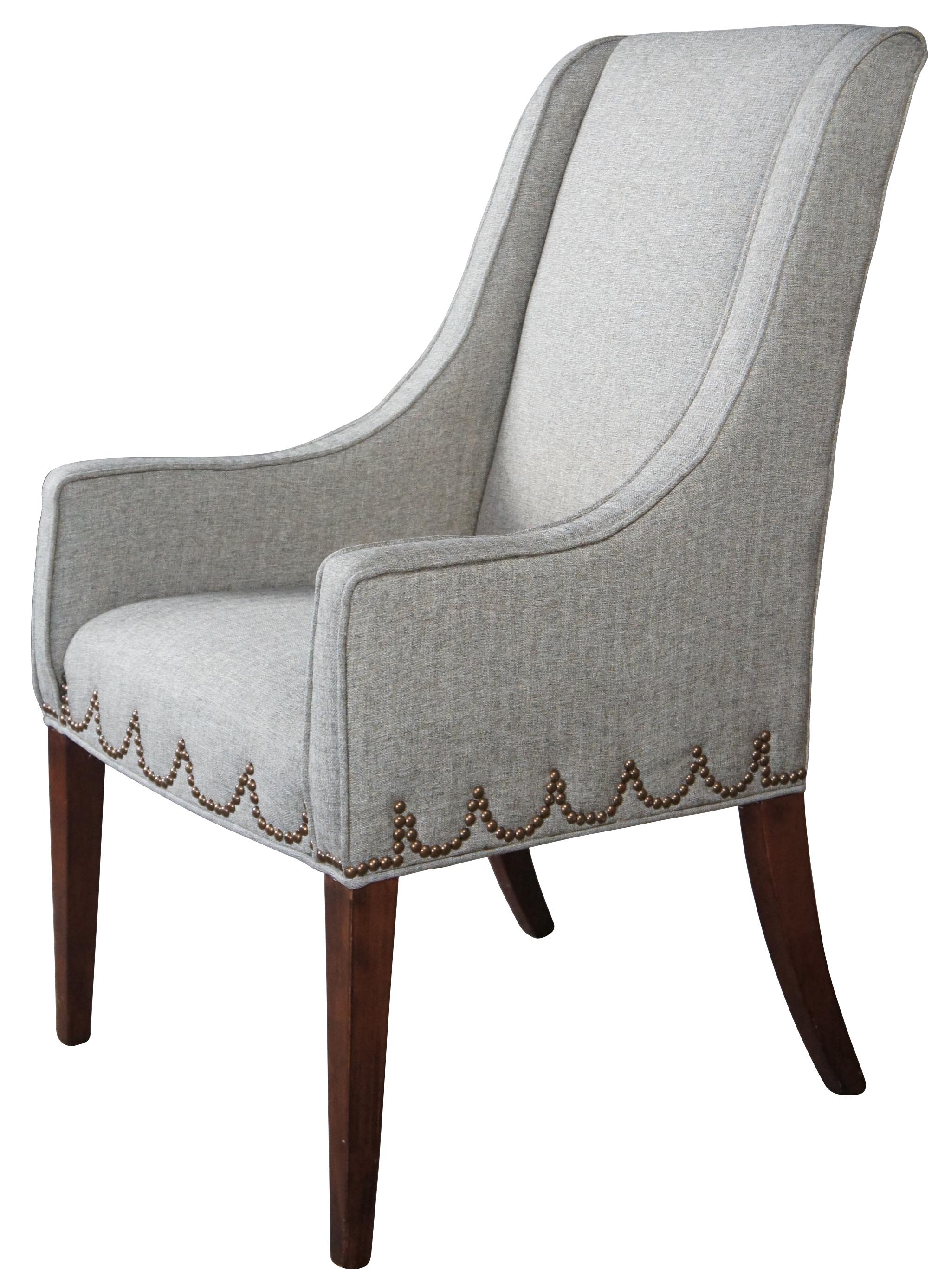 Universal furniture gray slipper arm chair. Graceful lines with Hepplewhite styling, nailhead trim and square tapered mahogany finished legs.
 