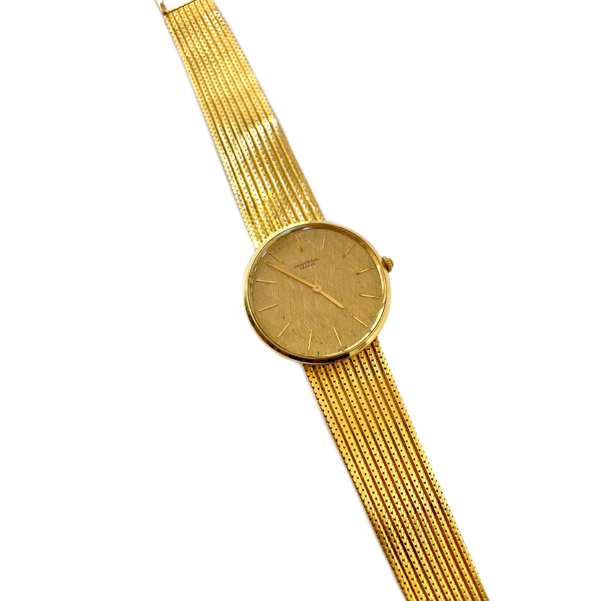 Universal Geneve 18 Karat Yellow Gold Wrist Watch circa 1960's. The watch contains the original 21 jewel mechanical wind movement. The design of the round dial is a unique cross hatch pattern enclosed within a 33mm case. The length of the band is 7
