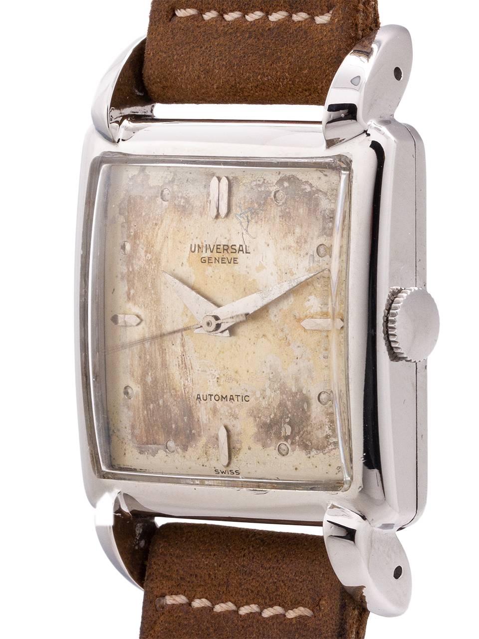 
A great looking Universal Geneve stainless steel oversize 30 X 43 dress model circa 1950’s. Large for the era, with beefy design domed shaped case with prominent horn shaped lugs. With original and drastically aged silver dial with steel hour