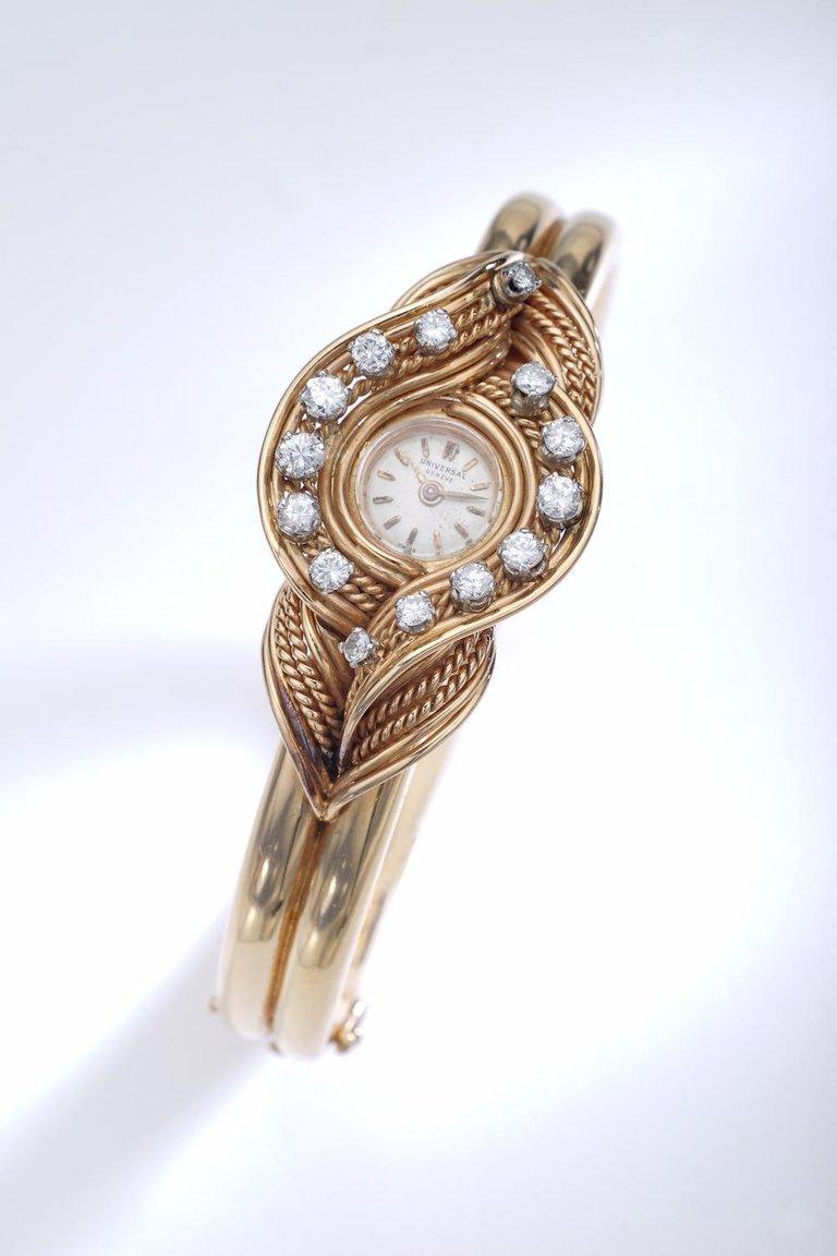 Not only a watch but also a jewel. Retro design is purely elegant. All yellow gold wristwatch the dial is surrounded by round cut diamond.
Signed Universal GENEVE, numbered.
Circa 1940.

The watch has not been tested to determine the accuracy of its