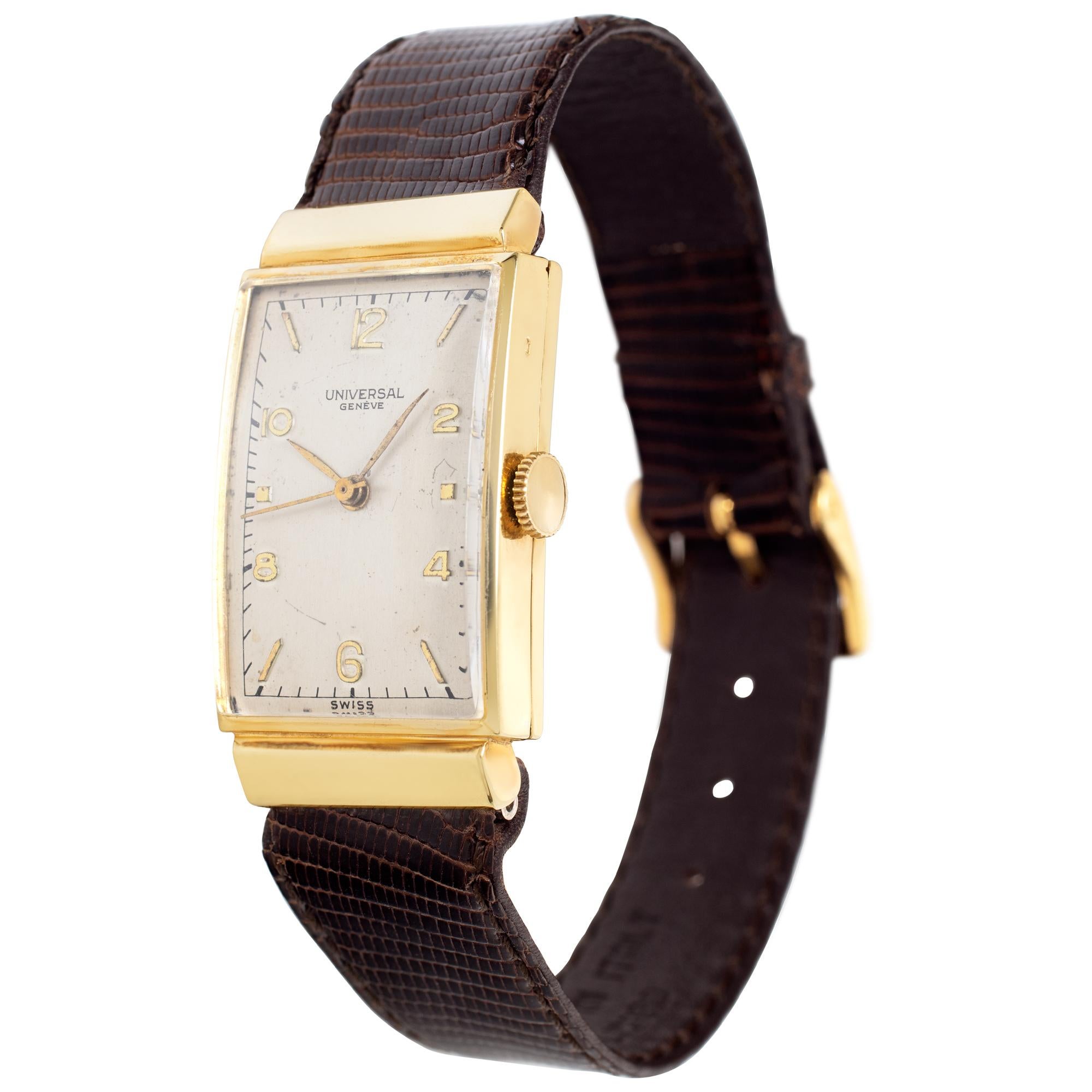 Vintage Universal Geneve manual wind watch in 14k yellow gold 21mm on a leather strap with cream stick/arabic numeral dial and sweep second hand. Ref 58927. Fine Pre-owned Universal Geneve Watch. Certified preowned Vintage Universal Geneve 58927