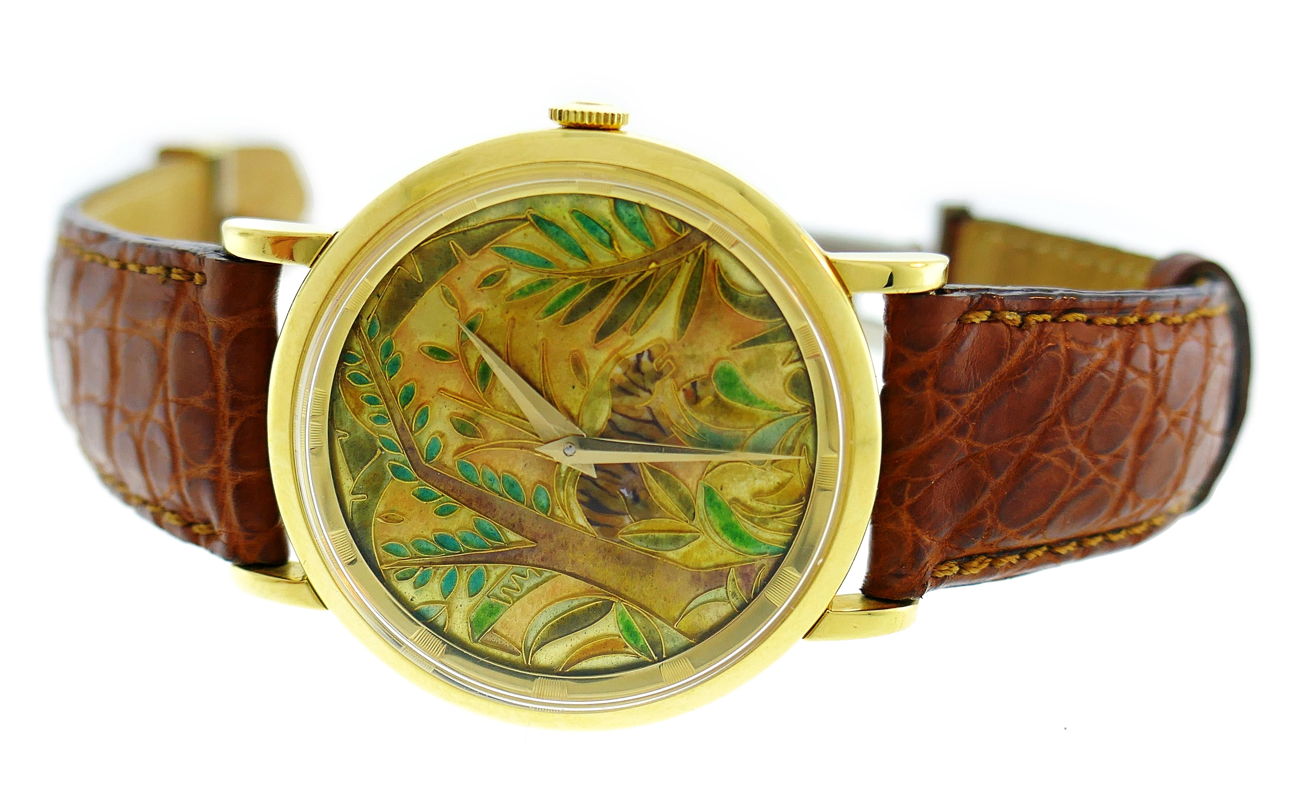 Classic unisex wristwatch with colorful three-dimensional cloisonne enamel dial created by Universal Geneve. Outstanding craftsmanship in cloisonne enameling technique, earthy colors of enamel, gold and leather band make this elegant timepiece a