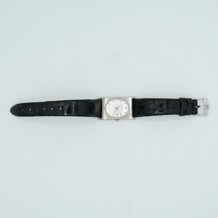 watch in white gold, UNIVERSAL black leather .1960's