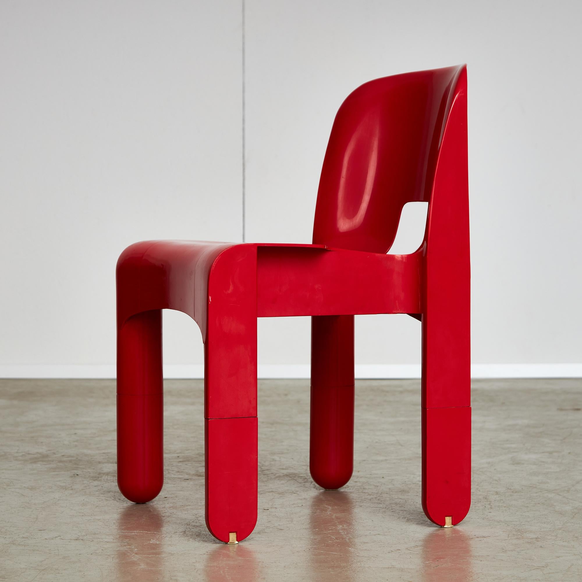 Universale Chair 860/861, the pioneer chair to be molded from a single material, by Joe Colombo for Kartell, 1970s, in a vibrant red colour. It features a unique stamp: “Kartell Binasco (Milano) 860 e 861”. Not only is this chair visually striking,