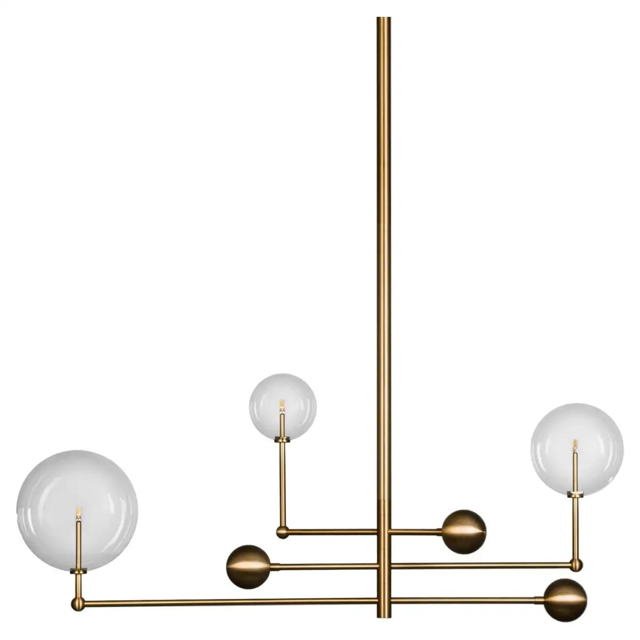 Universe brass chandelier by Schwung.
Dimensions: D 25 x W 128.2 x H 178 cm.
Materials: Solid brass, hand-blown glass globes.
Finish: solid natural brass.
Also available in finishes: polished nickel or black gunmetal. 
All our lamps can be