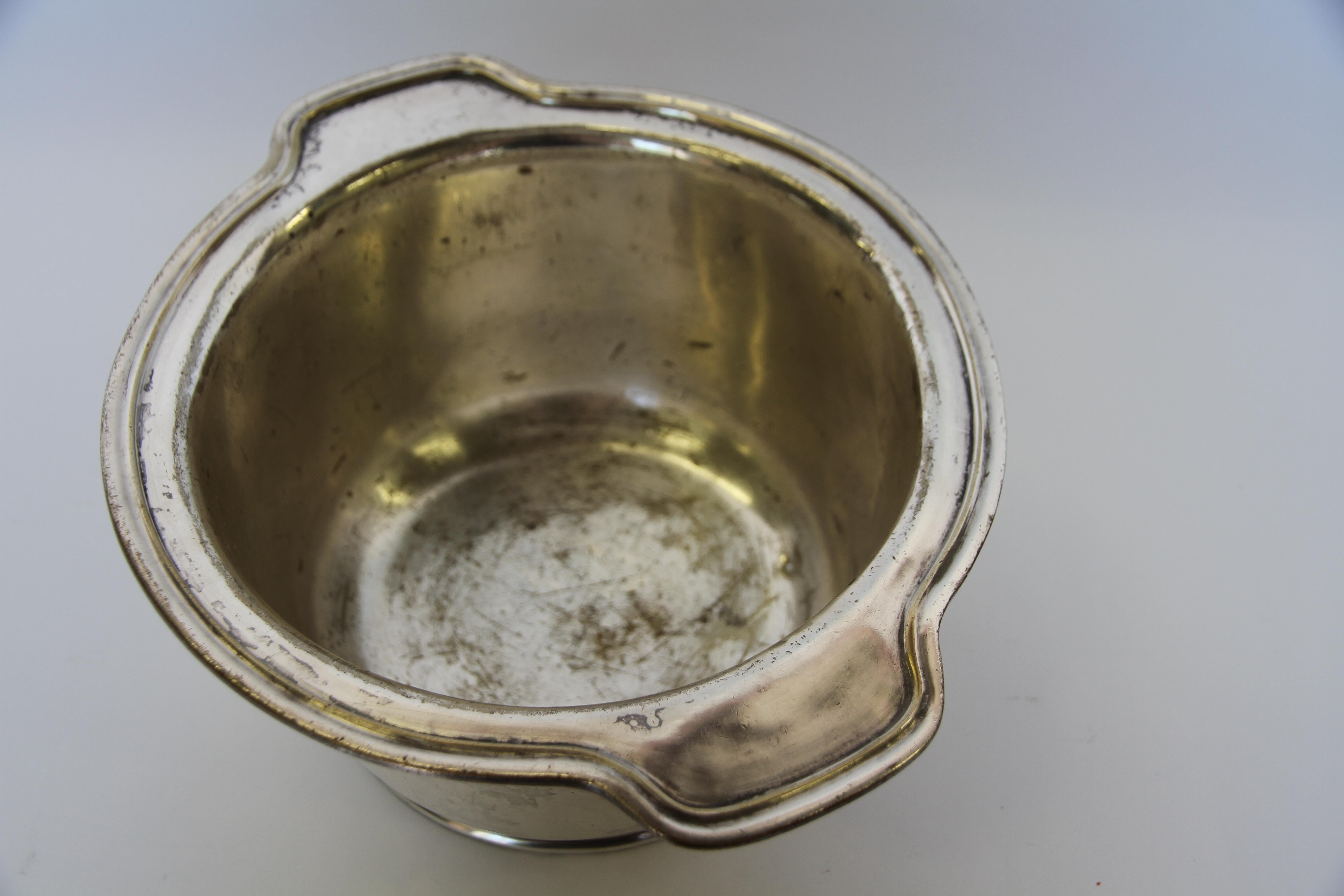 A silver soldered ice bowl or chiller made by the International Silver Company for the University of Notre Dame. With a classic shape these pieces were made extra dense and heavy so as not to spill when in use. Marked University of Notre,