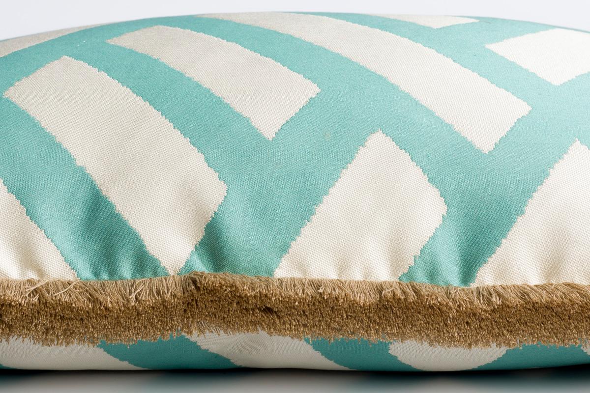 Universo turchese blue and white geometric print cushion/pillow: Imbue your living room with this geometric blue print combined with a beautiful natural trimming. This bright uplifting color has the power to enhance any piece of furniture. All