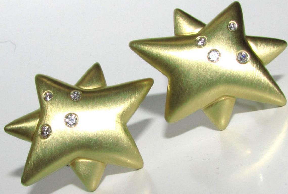 Unique Modified Star diamond earrings

8 bezel set diamonds

.50ct. 

F-color, Vs-1 clarity.

18kt. yellow gold

36mm long

28mm wide

33.8 grams