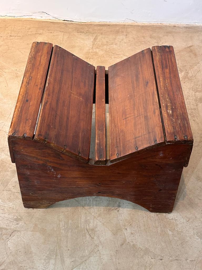 Artisan bench made to sit with crossed legs or sit in a squat position. This kind of seating was commonly made in the Brazilian countryside from the 18th century to the beginning of the 20th century. This piece has a beautiful patina, its exact date