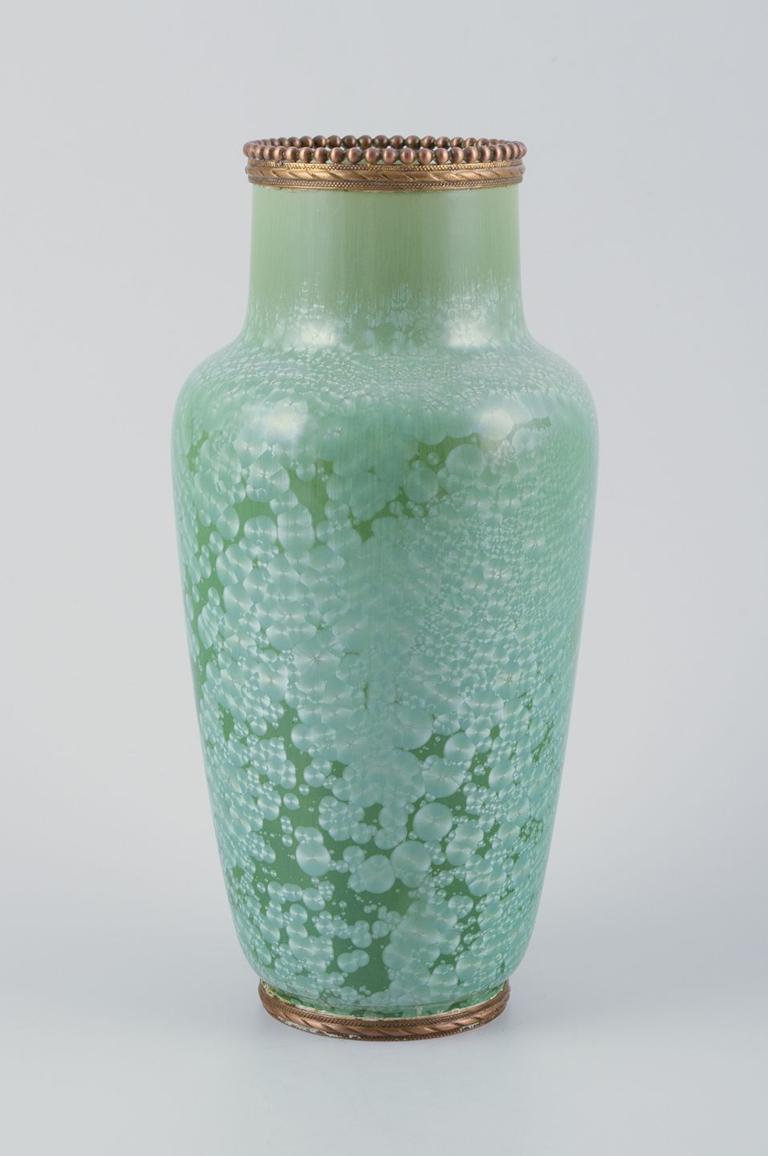 PRE-OWNED GOODS ARE EXEMPT FROM IMPORT TARIFFS FOR U.S., UK, AUSTRALIAN & CANADIAN CUSTOMERS.   
THEREFORE, NO IMPORT TARIFFS WILL BE APPLICABLE TO YOUR PURCHASE. 

Unknown French ceramicist.
Vase of stoneware. Crystal glaze in green tones.
Brass