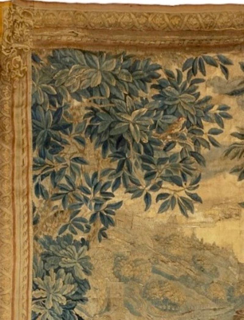 A French mid 18th century silk and wool hand woven tapestry, depicting a scene of villagers having a drink and a smoke. A very unique scene for a tapestry in the taste of David Teniers from northern France or The Flanders. This tapestry has kept its