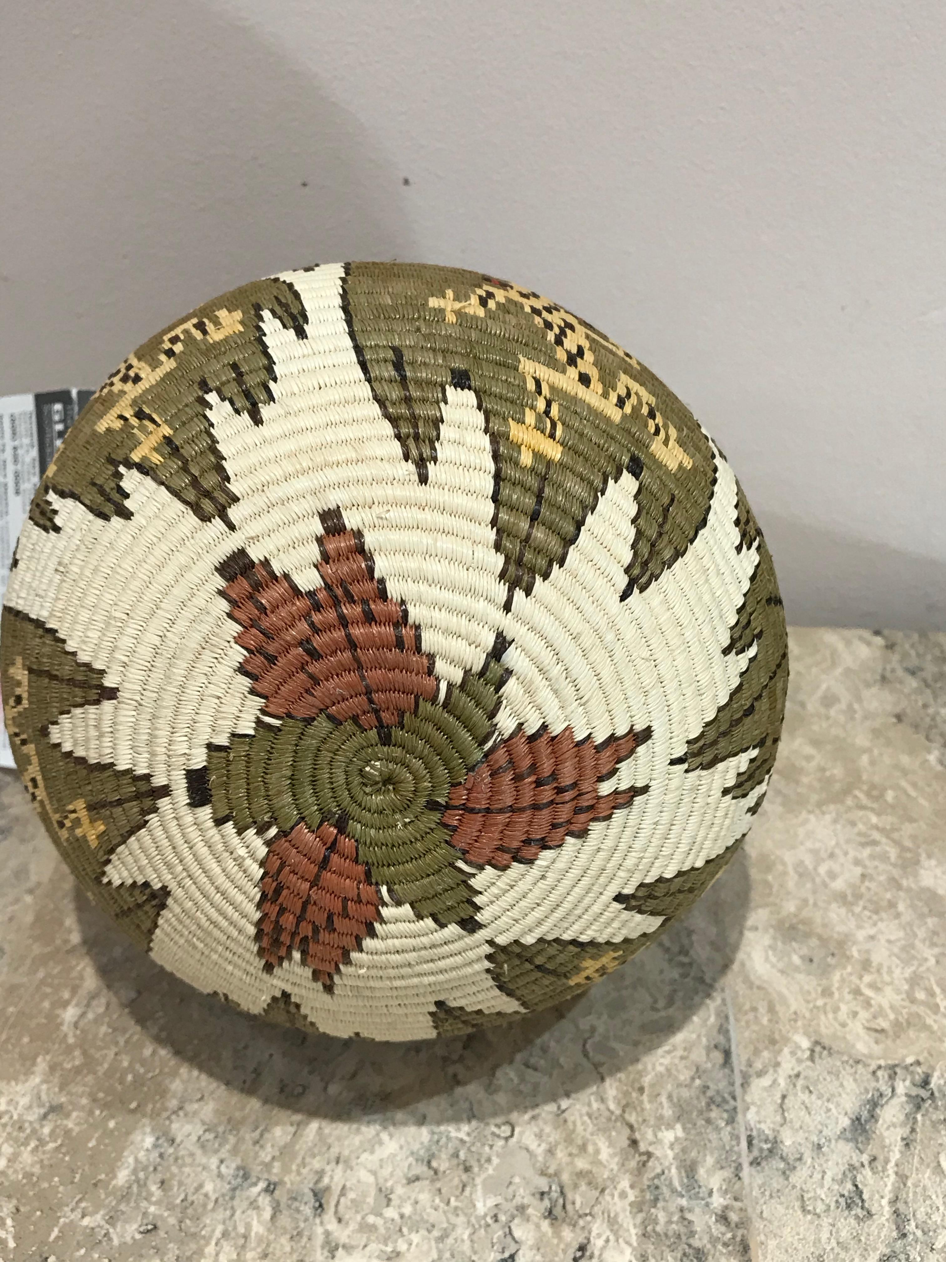 Basket, Tree Frogs, Wounaan Tribe, Panama, Darien Rainforest, green, white, etc

The baskets are made by the Wounaan and Embera Indians from the Darien Rainforest in Panama.  The Wounaan believe they emerged from the palm tree. They weave baskets