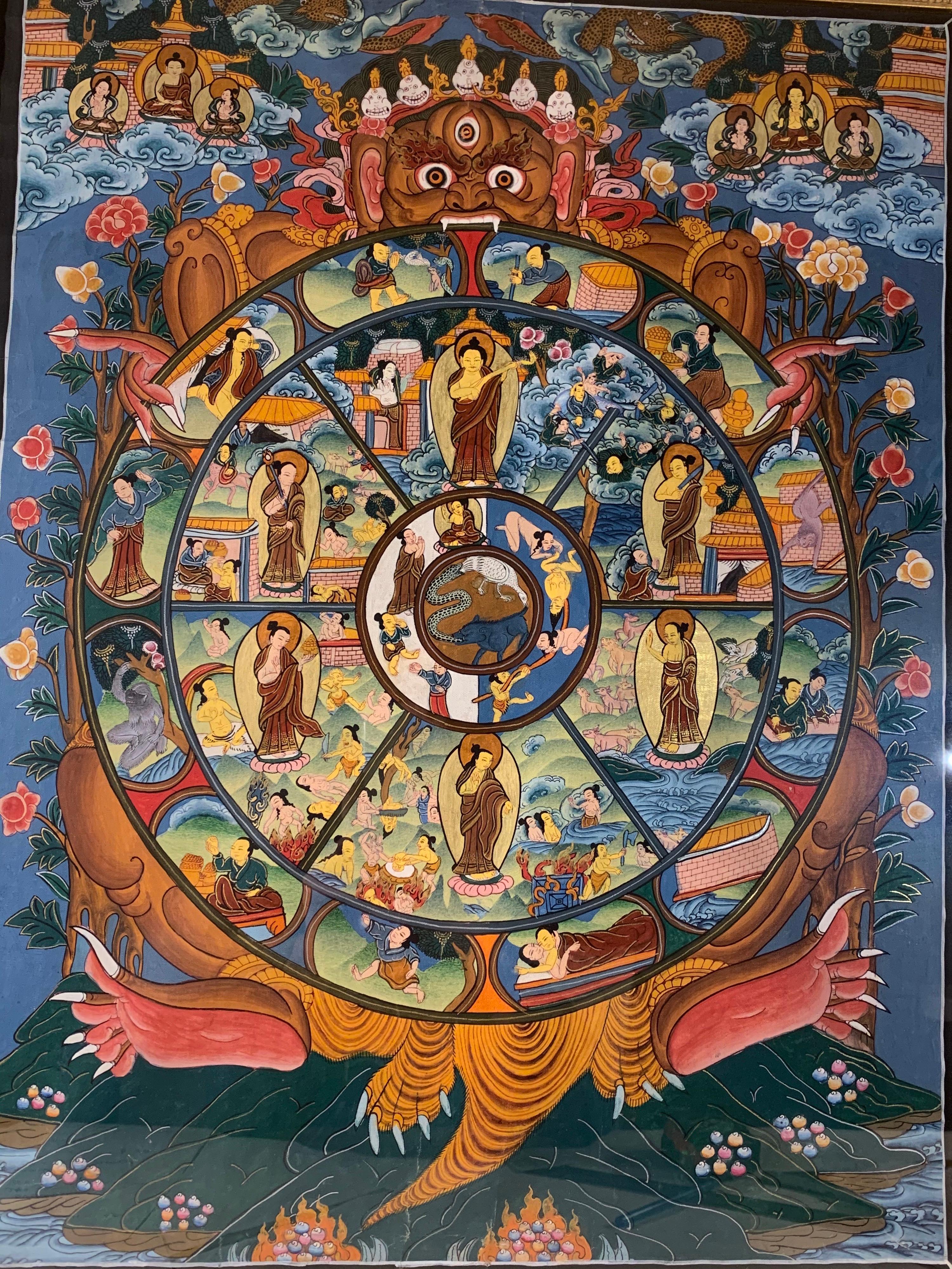 This wheel of life thangka is hand painted on canvas with 24k gold. Beautifully framed, the art itself is an outstanding work. 
The 