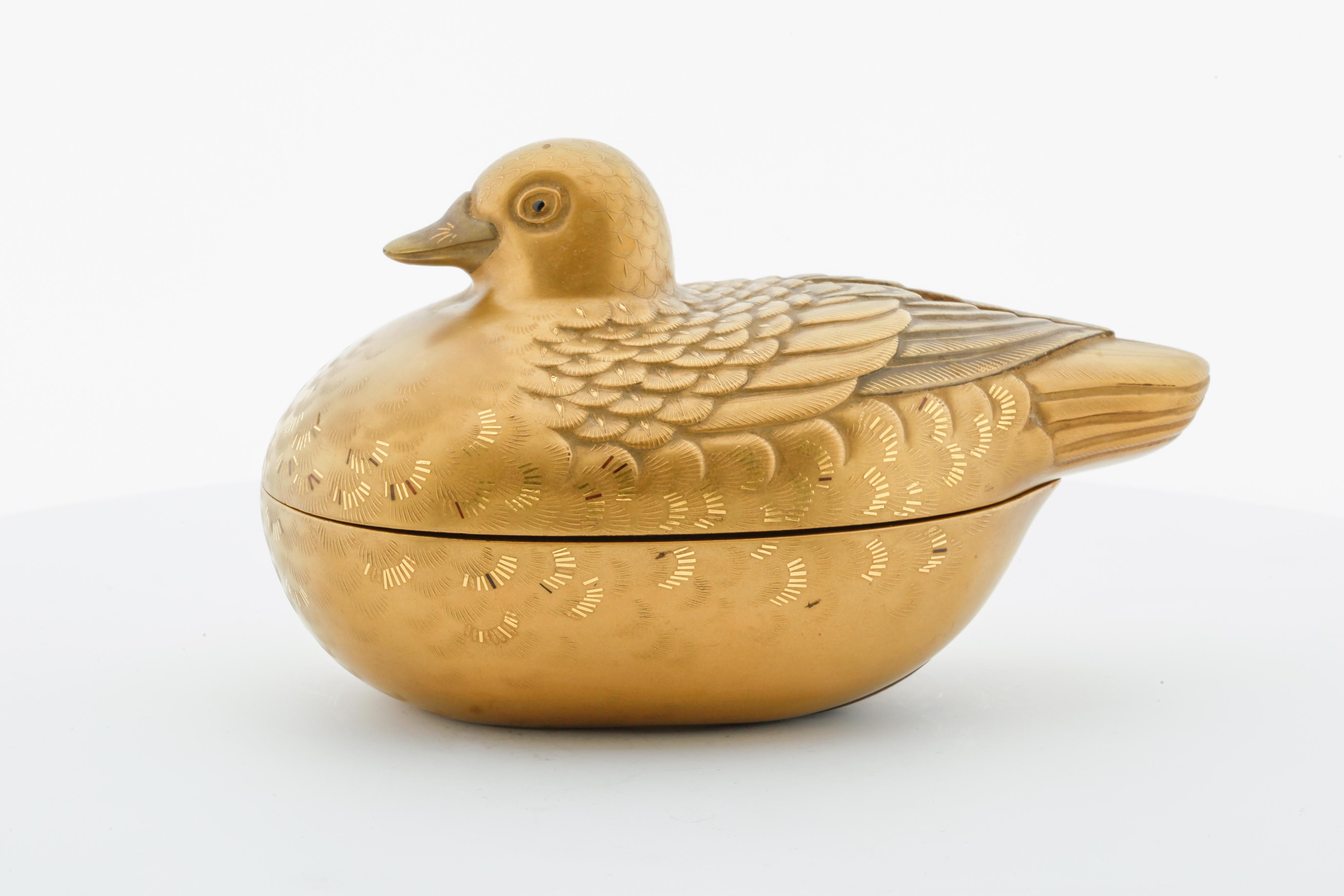 Title: Small Lacquer Incense Box 
Date: 19th century 
Dimensions: (W) 7 (D) 12 (H) 7 cm
Condition: Wear consistent with age and use. 

A small lacquer incense box and cover in the shape of a duck with decoration in iroe hiramakie and takamakie.