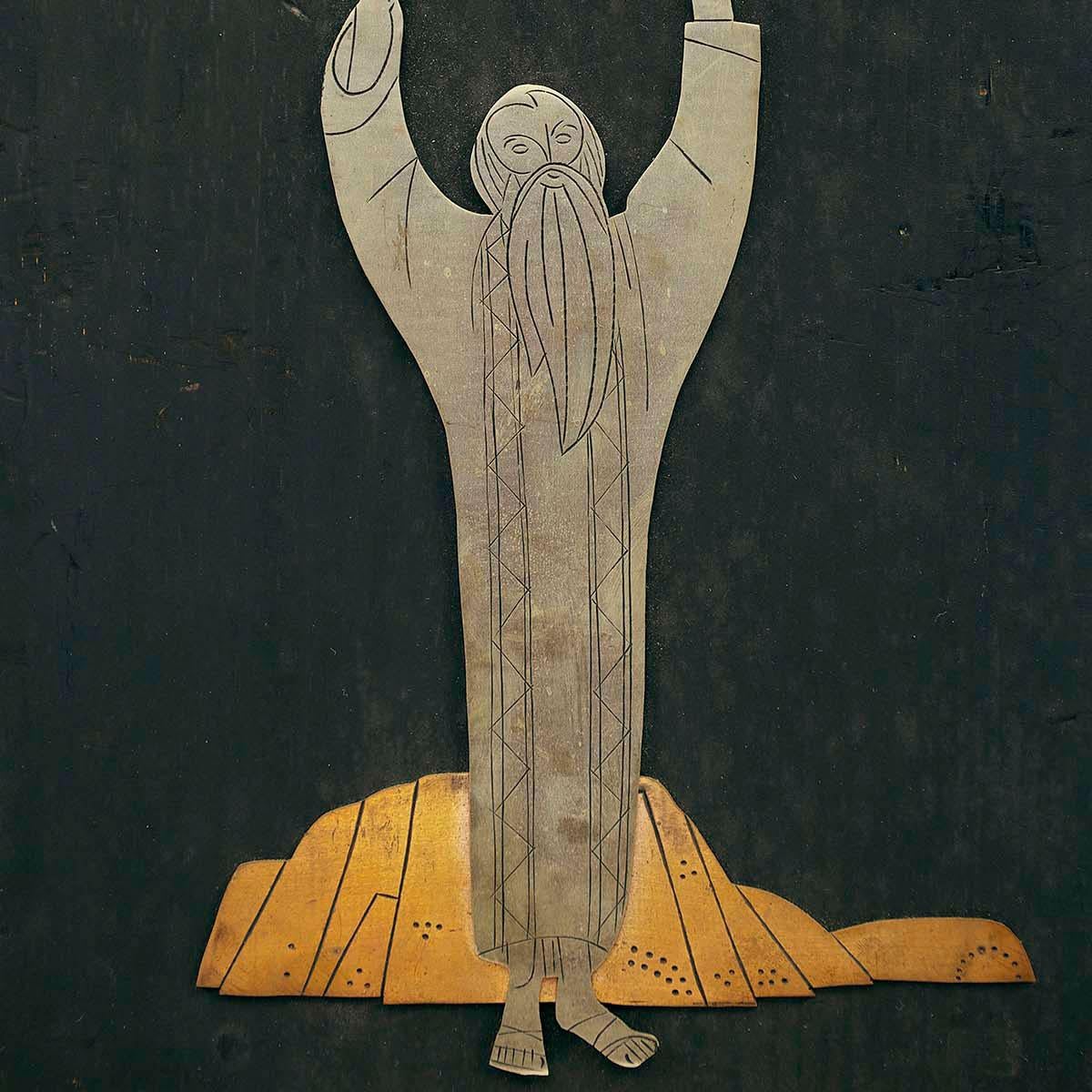 In this art work the artist portrays Moses holding the Ten Commandments by overlaying sheets of metal on top of each other. The composition is flat, and the figure shows cartoon-like features.