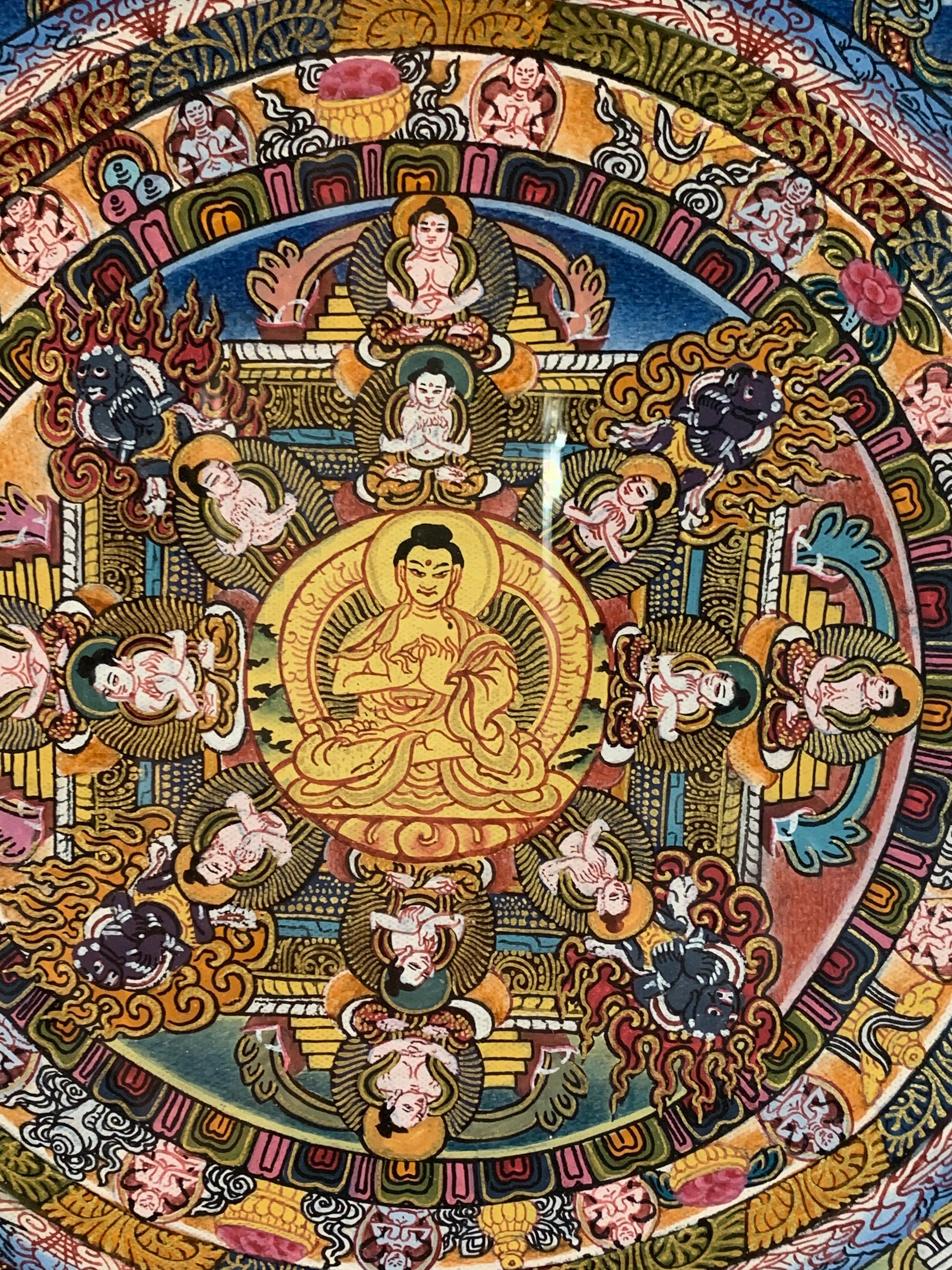 This mandala thangka is hand painted on canvas with 24k gold. Different hues of gray,green and peach colors blend seamlessly with the shimmering of real gold.
The measurement of the frame is 38.5 
