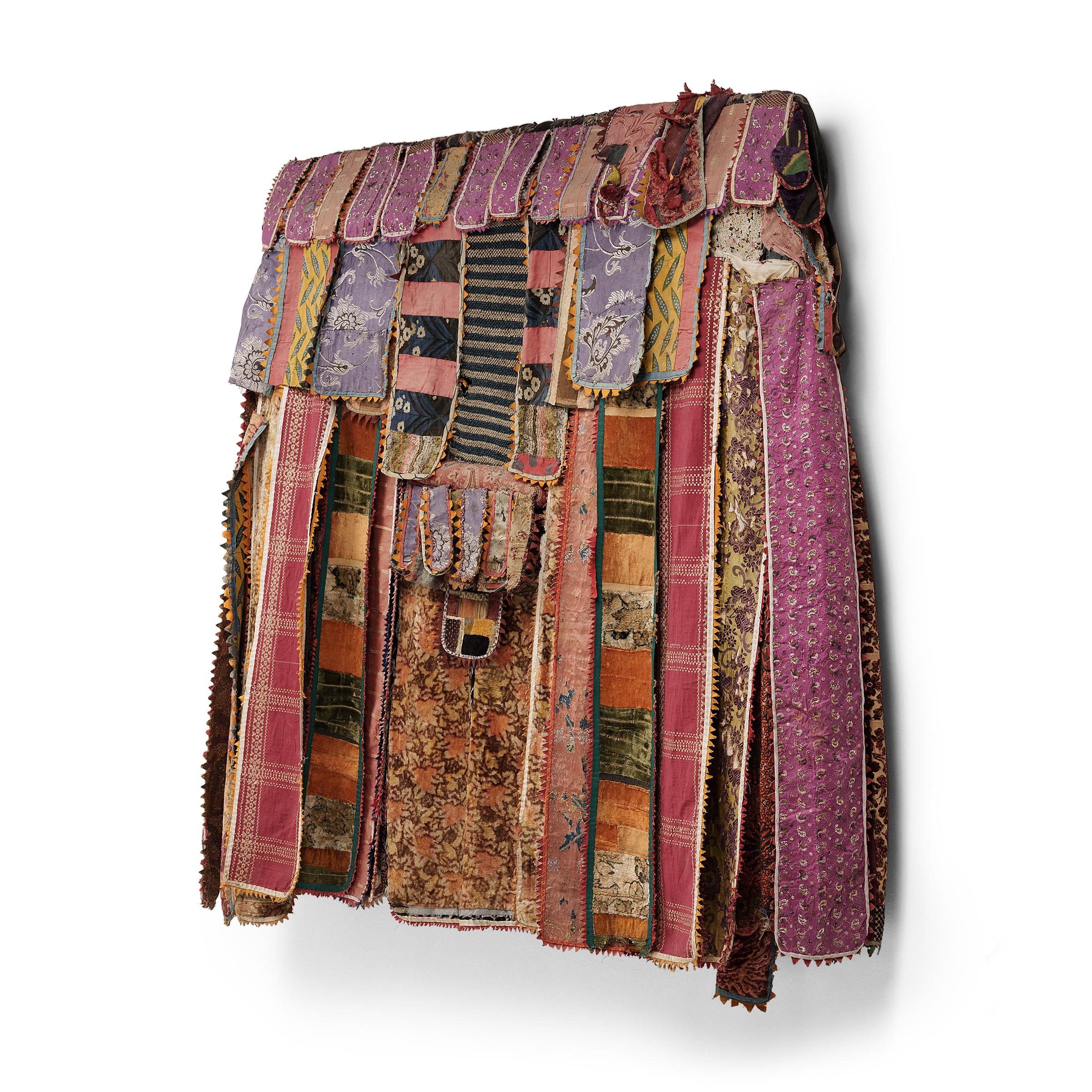 This remarkable textile is a dance costume worn by an Oyo Yoruba performer during the annual masquerade known as Odun Egungun, or “powers concealed.” The Egungun masquerade varies widely in appearance and content depending on the region, but all