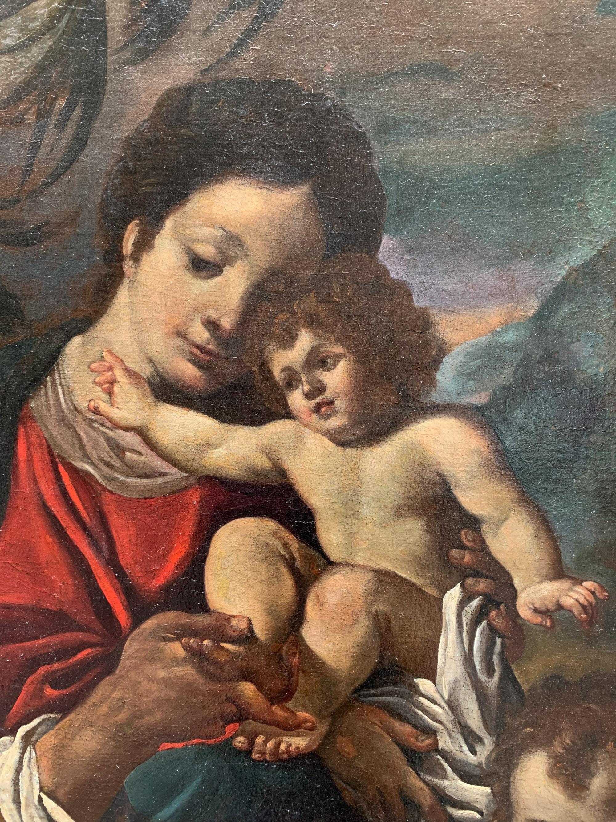 17th century . Holy Family with the Saint John the Baptist – Bolognese School - Painting by Unknown