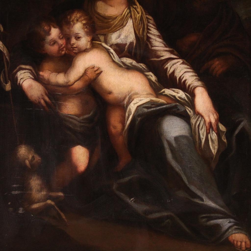 Prächtiges italienisches Gemälde aus der zweiten Hälfte des 17. Jahrhunderts. Kunstwerk in Öl auf Leinwand, das eine Heilige Familie mit dem Johanneskind darstellt, von bemerkenswerter malerischer Qualität. In der Komposition finden wir alle