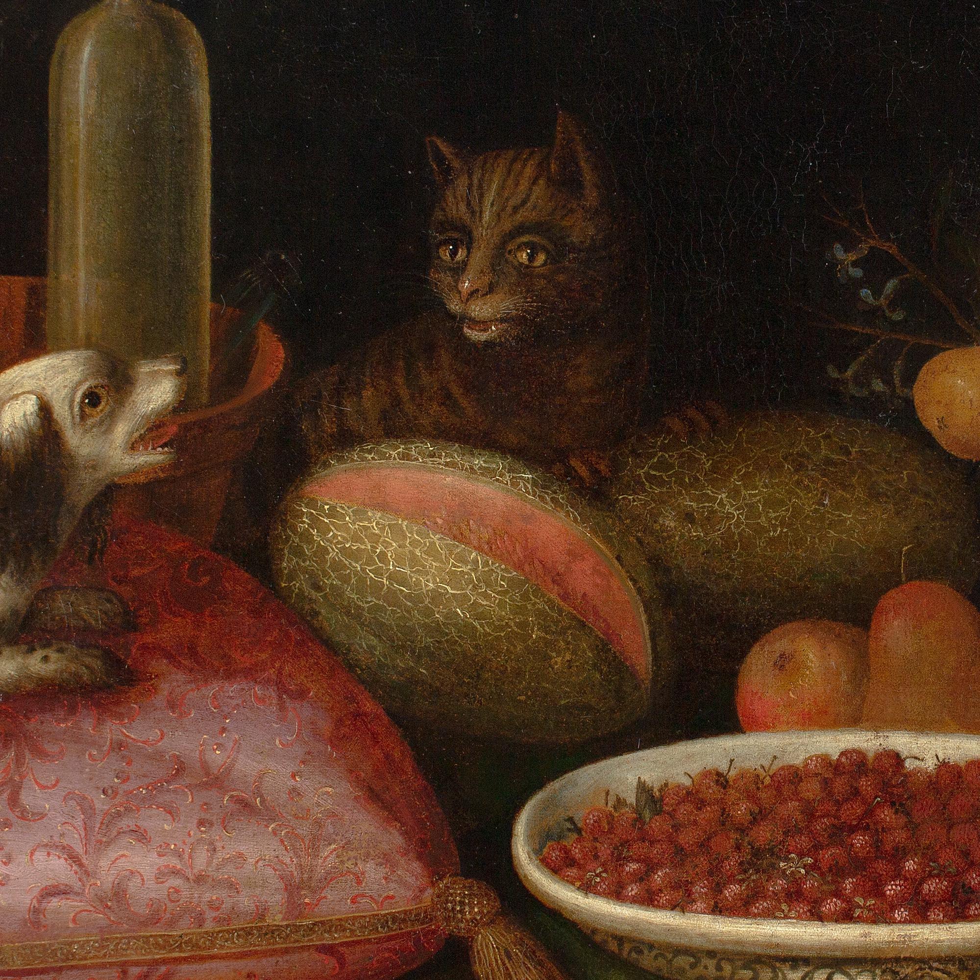 Cette fabuleuse nature morte flamande de la fin du XVIIe siècle représente une pléthore de fruits, un panier de fleurs, un chat, un chien, un coussin et des jus.

Produites vers 1690, les natures mortes généreuses de cette nature avaient une double
