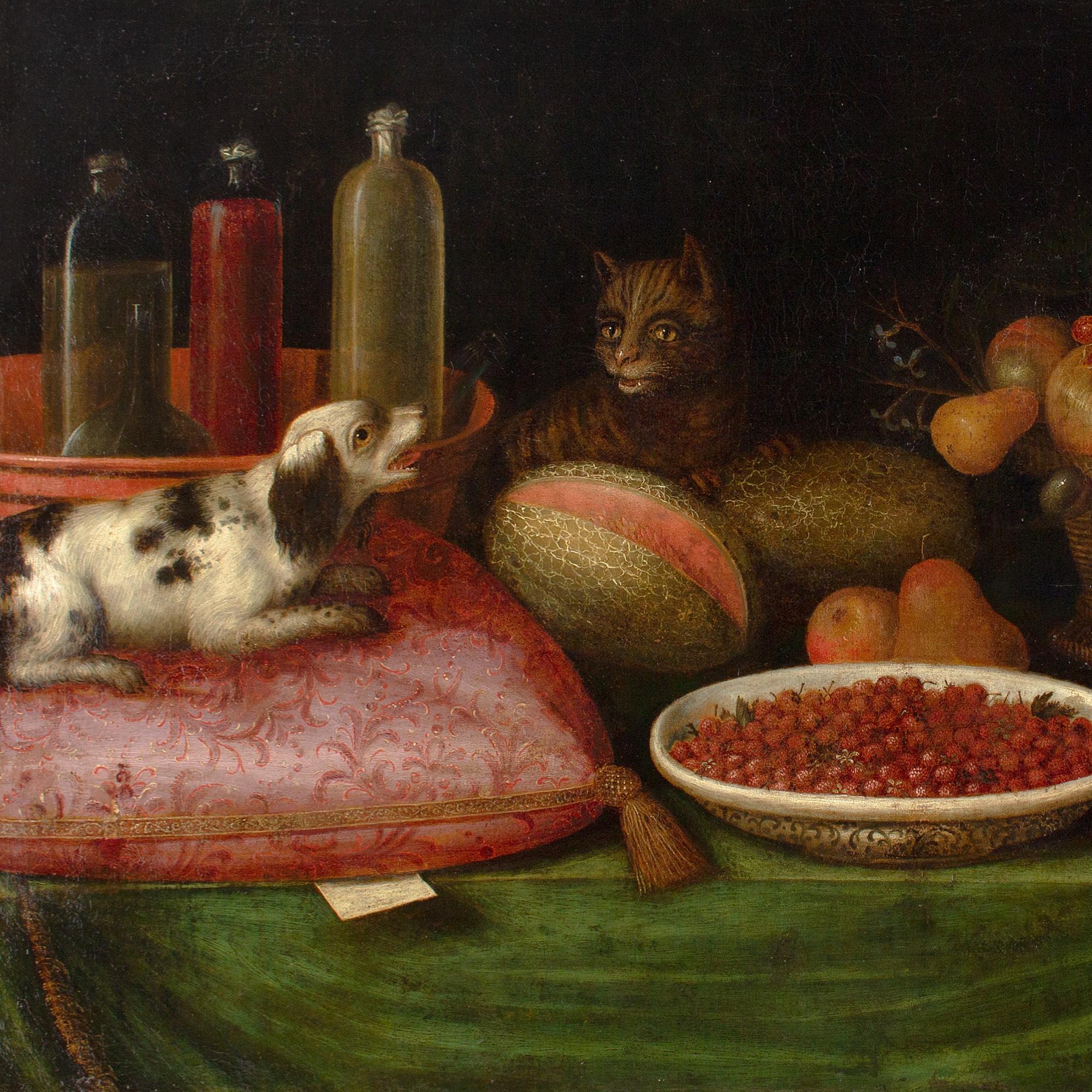 Nature morte provinciale flamande du 17e siècle avec fruits, chat, chien et fleurs 1