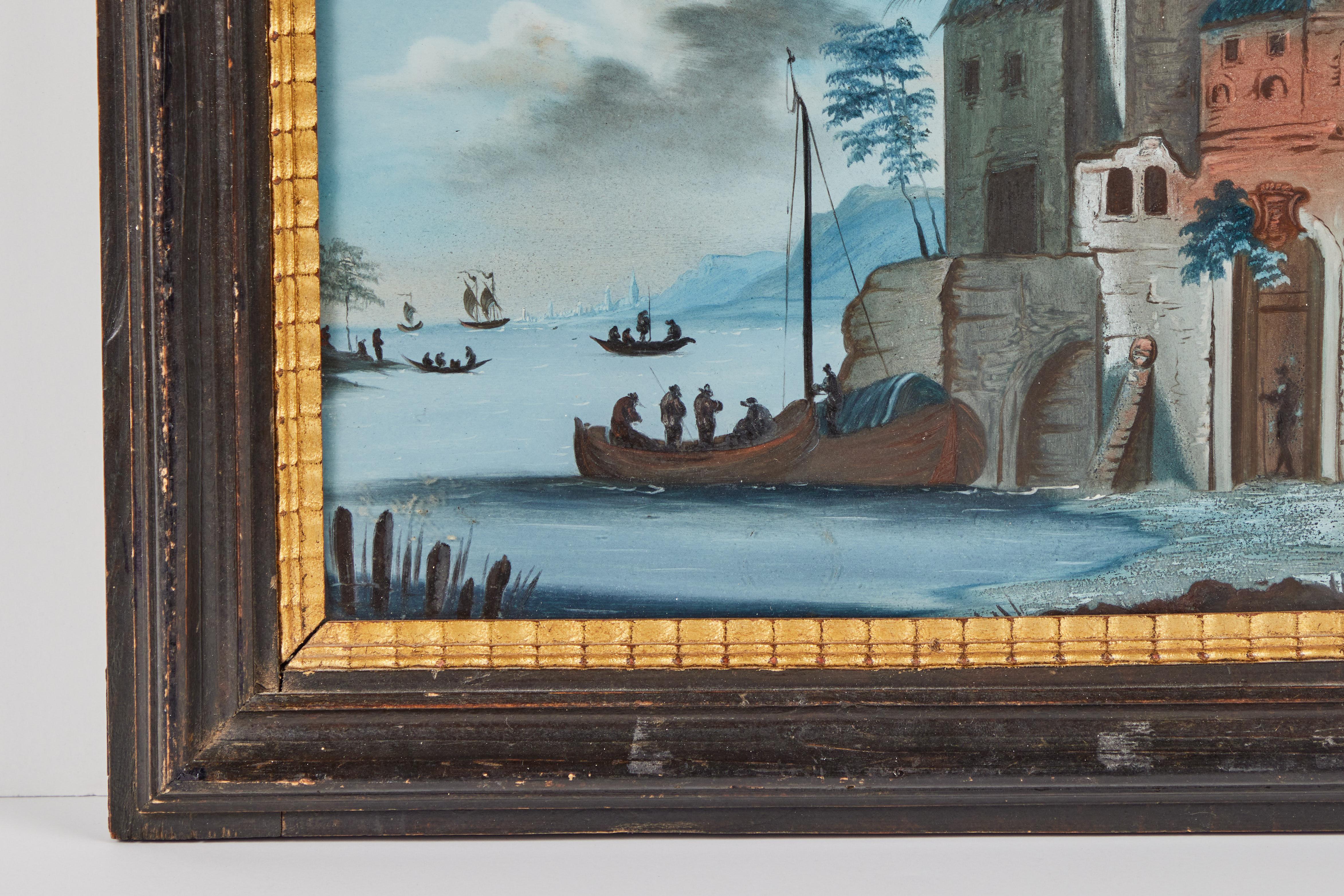 A rare pair of mated, hand-painted, verre églomisé, 17th c. Dutch harbor scenes featuring figures, a variety of boats, and foreground buildings. Each held in antique, hand-carved, parcel gilt frames.