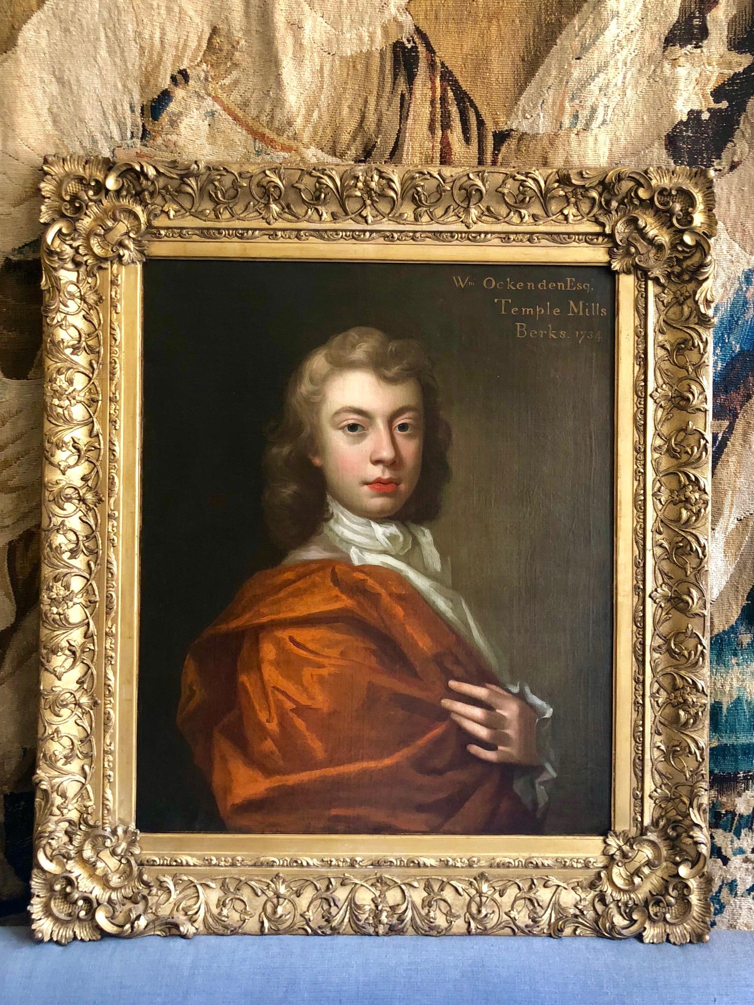 18th Century Portrait of William Ockenden in an Orange Robe.

Fine, sensitively rendered early/mid 18th century portrait of William Ockenden, of Temple Mills Berkshire, half length wearing a russet brown Mantle with a White Cravat. Signed and
