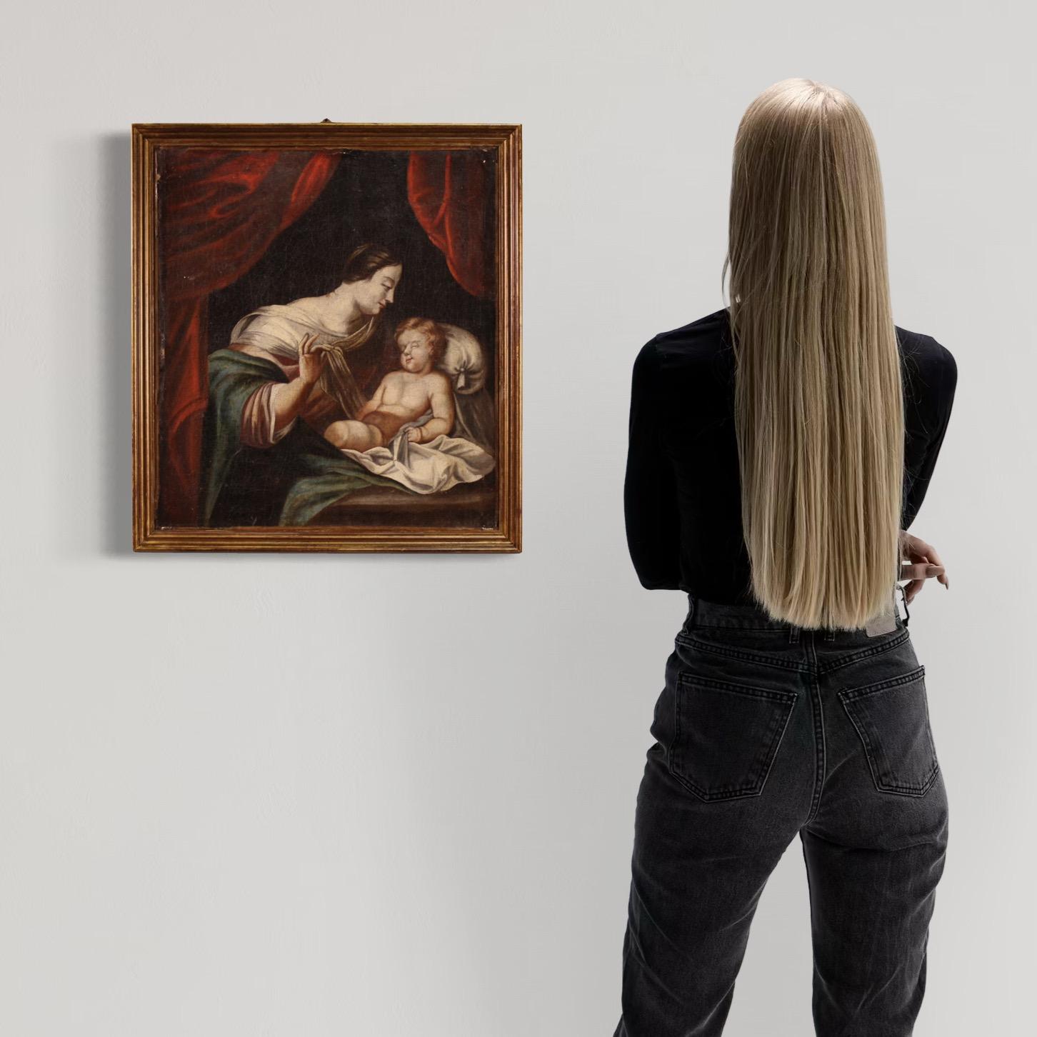 Antique French painting from the mid-18th century. Oil on canvas artwork depicting a Madonna with child of good pictorial quality. Painting of excellent proportion and small size, easily placed in different parts of the house. Wooden frame from the