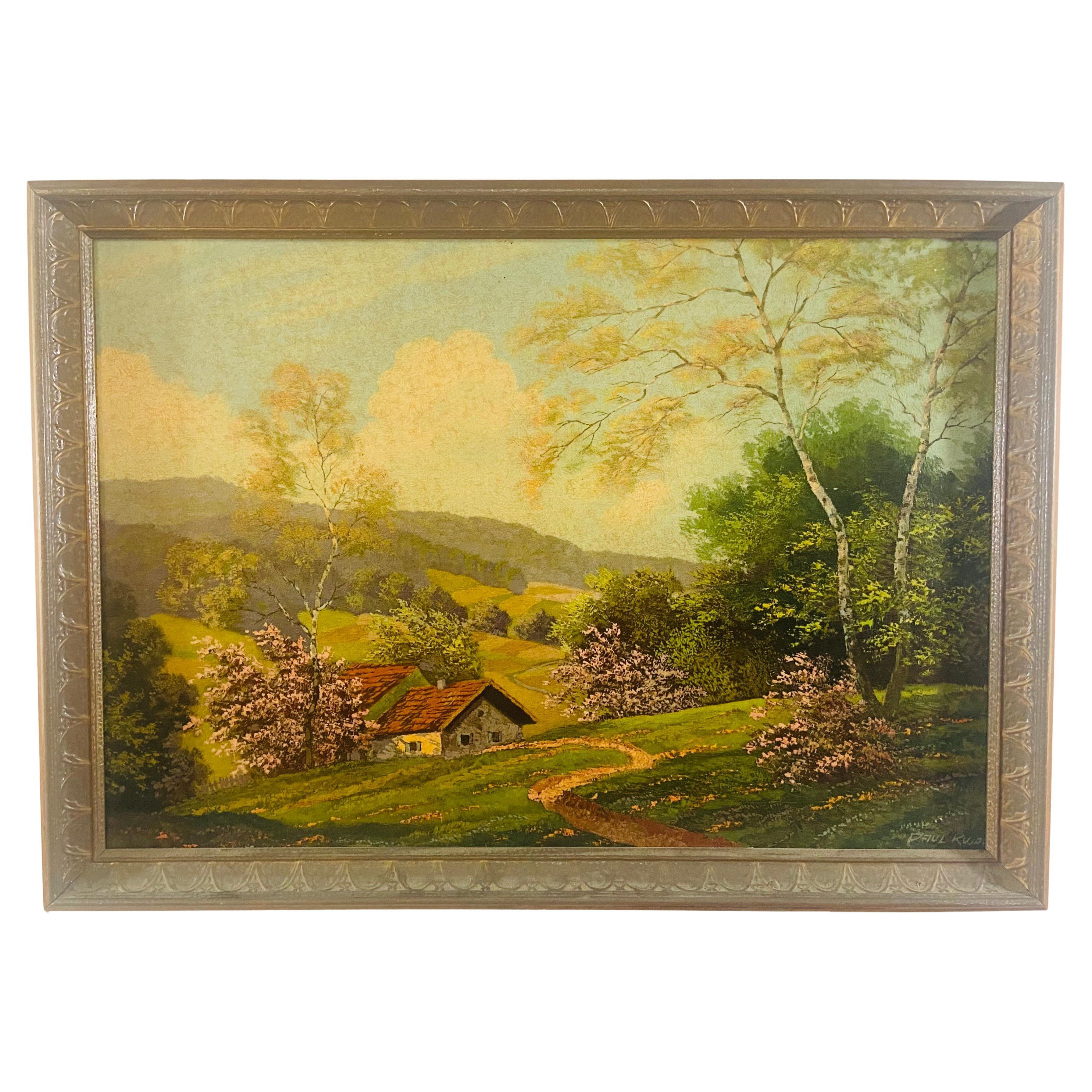 An oil on board landscape painting by artist Paul Kujal Austria (1894 - 1965). The painting depicts a serene scene of a cottage home in what it looks like a European village in the mountain area during the spring. Green trees , plants and blooming
