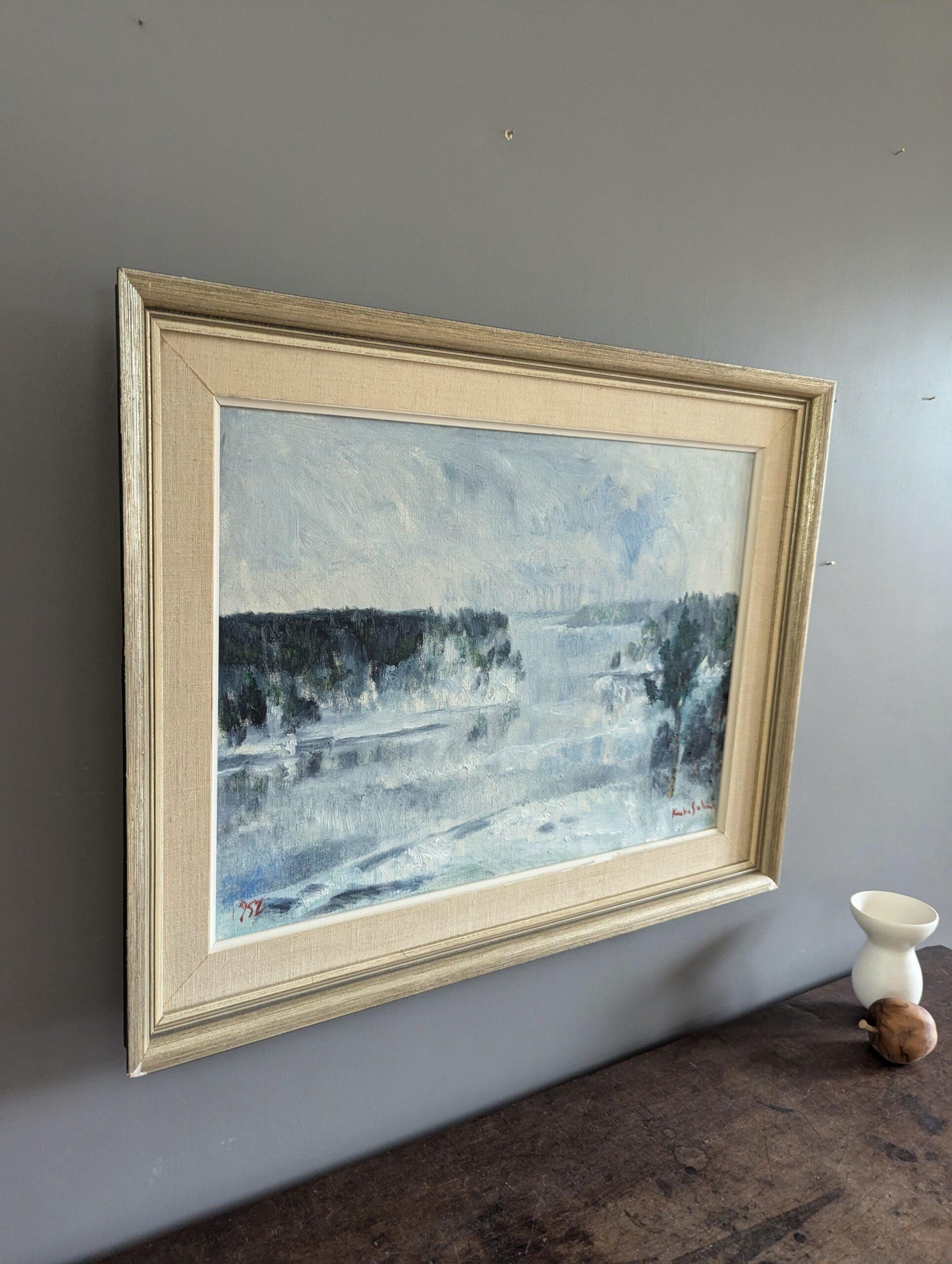 WINTER FOG
Size: 49 x 61.5 cm (including frame)
Oil on Canvas

A mid-century semi-abstract landscape composition that captures the serene and enigmatic essence of a winter forest by a river, painted in oil onto canvas and dated 1952.

The