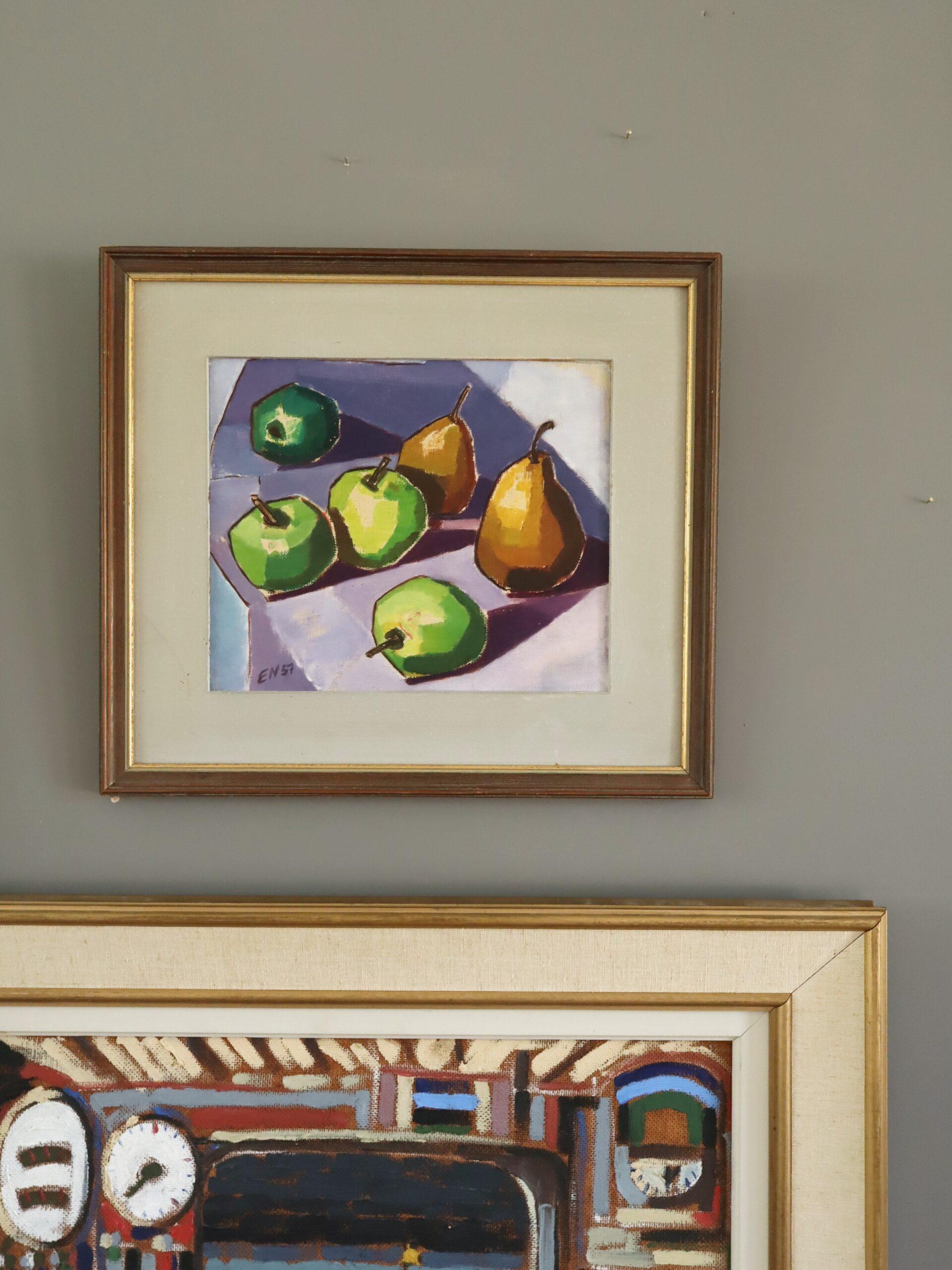 Green Apples & Golden Pears
Size: 35.5 x 40 cm (including frame)
Oil on board

An mid-century modernist still life captures a crisp arrangement of three green apples and two golden pears set against a cool-toned tabletop, executed oil oil onto board
