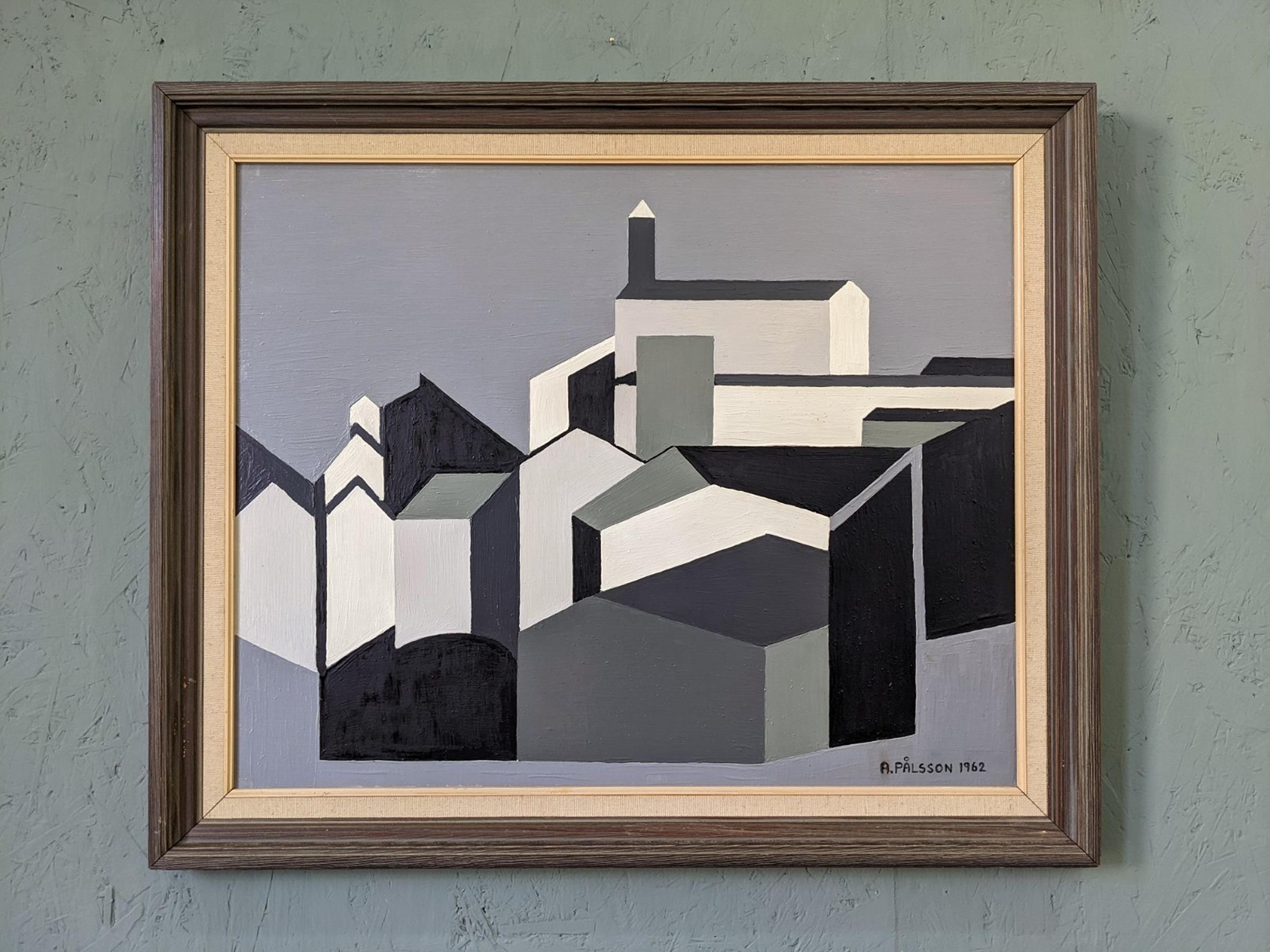 HOUSES IN MONOCHROME
Size: 54 x 65 cm (including frame)
Oil on board

A brilliantly executed cubist geometric mid century oil on board, painted in 1962.

Featuring angled shapes with hard edges that slot together seamlessly to form a view of houses,