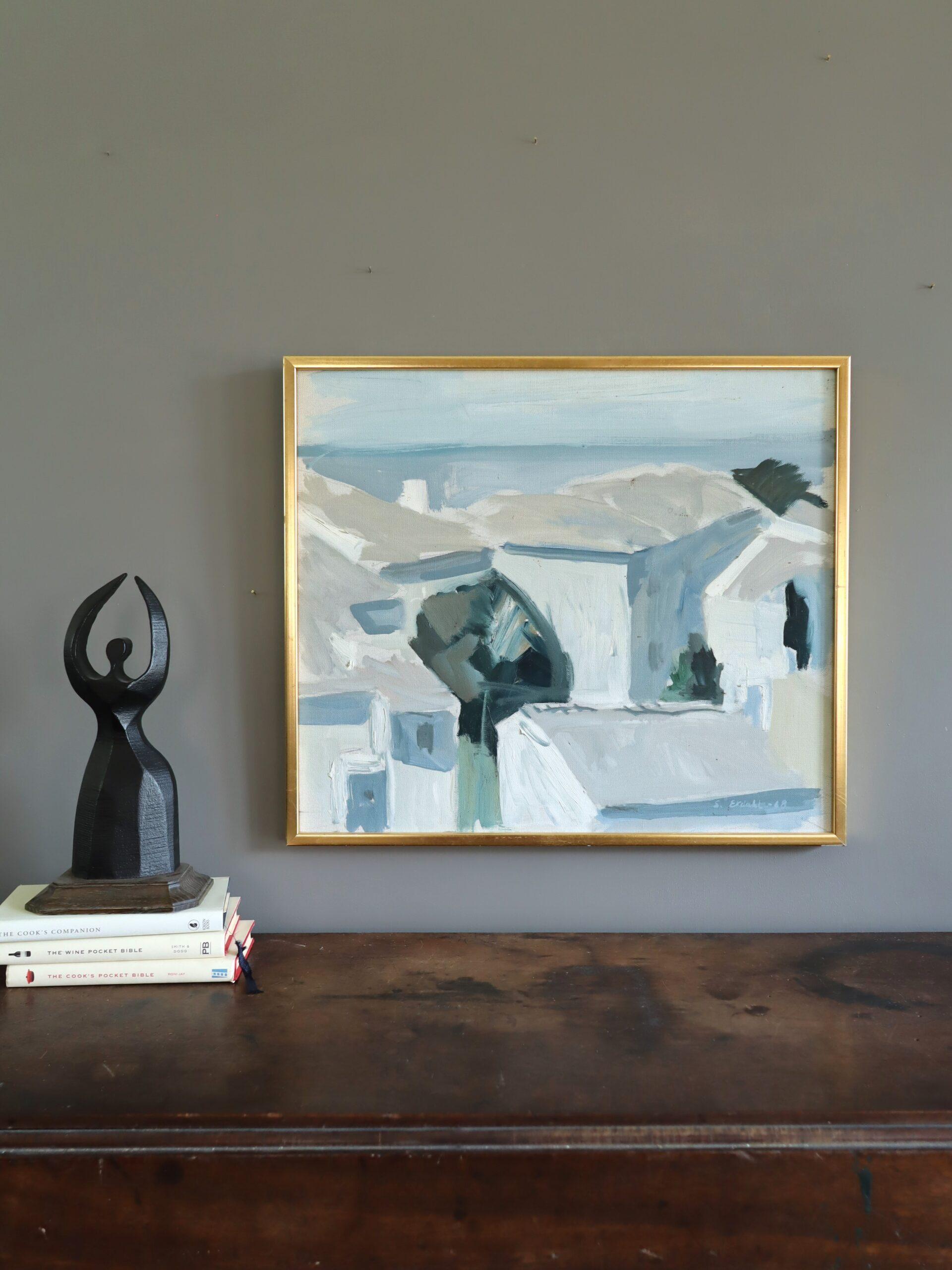 MEDITERRANEAN ROOFTOPS
Size: 49 x 56 cm (including frame)
Oil on canvas

A mid-century painting that captures the sunlit charm of a coastal Mediterranean village, where whitewashed houses rise in layered planes against the calm backdrop of the sea,