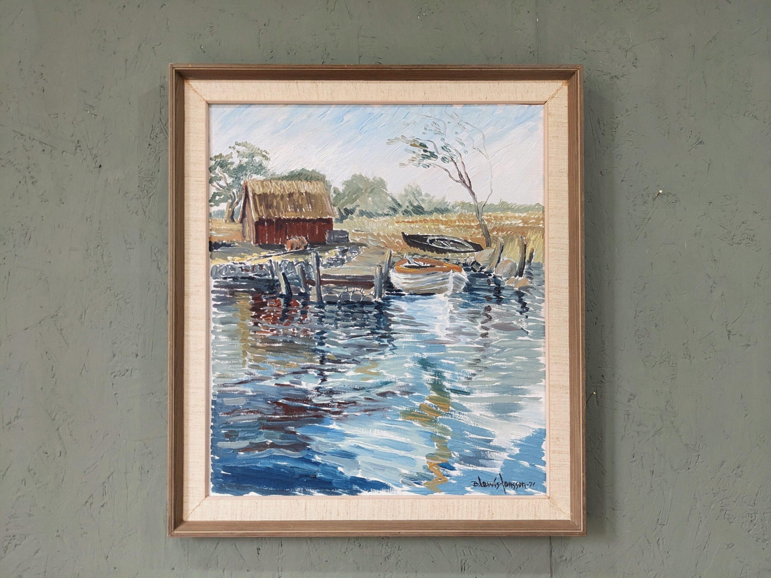 BOATHOUSE
Size:  54 x 48 cm (including frame)
Oil on canvas

A soothing and restful modernist style river landscape composition, executed in oil and dated 1971.

The composition presents a boat shed situated in lush greenery, and resting by a river