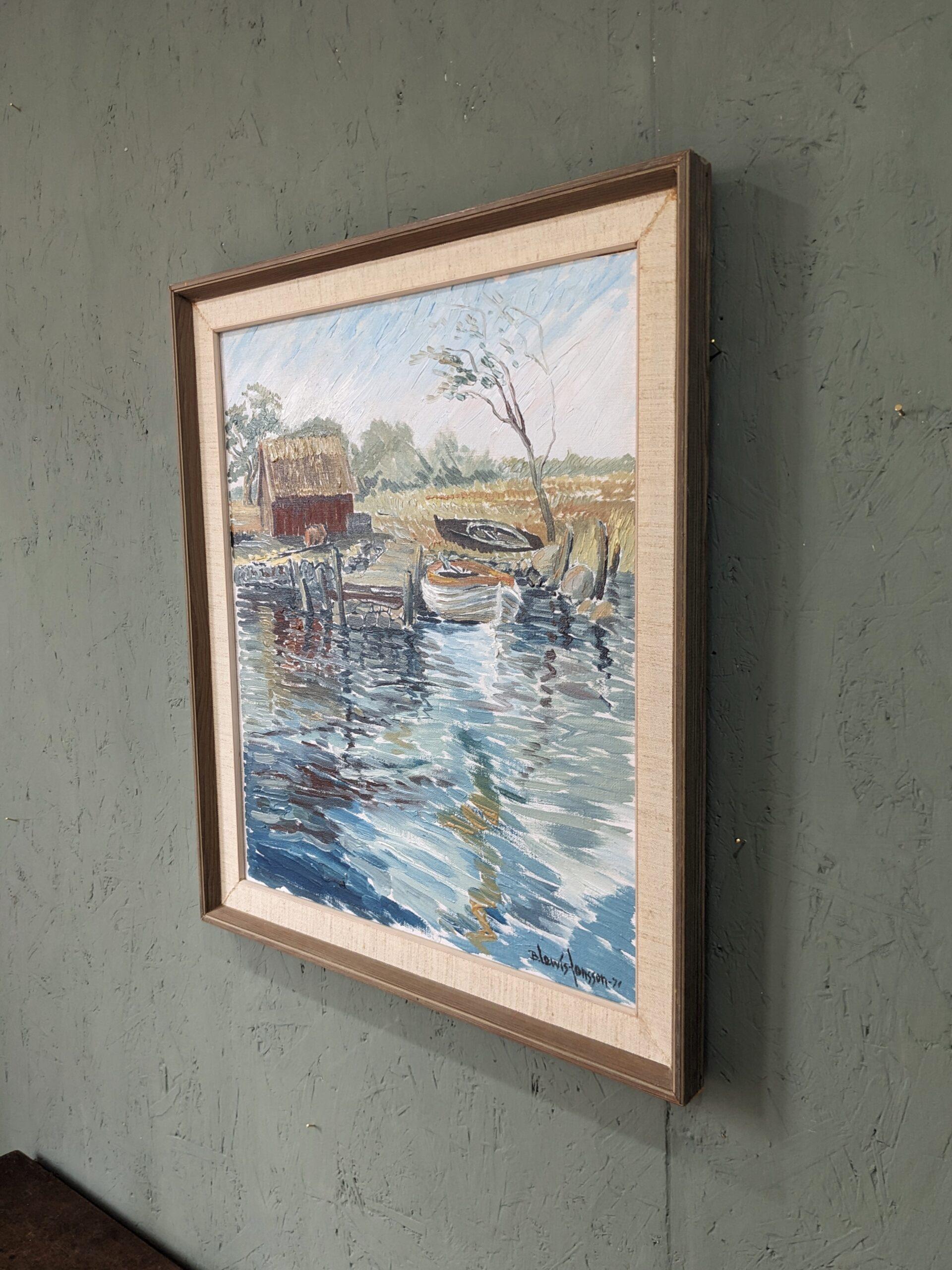 BOATHOUSE
Size:  54 x 48 cm (including frame)
Oil on canvas

A soothing and restful modernist style river landscape composition, executed in oil and dated 1971.

The composition presents a boat shed situated in lush greenery, and resting by a river
