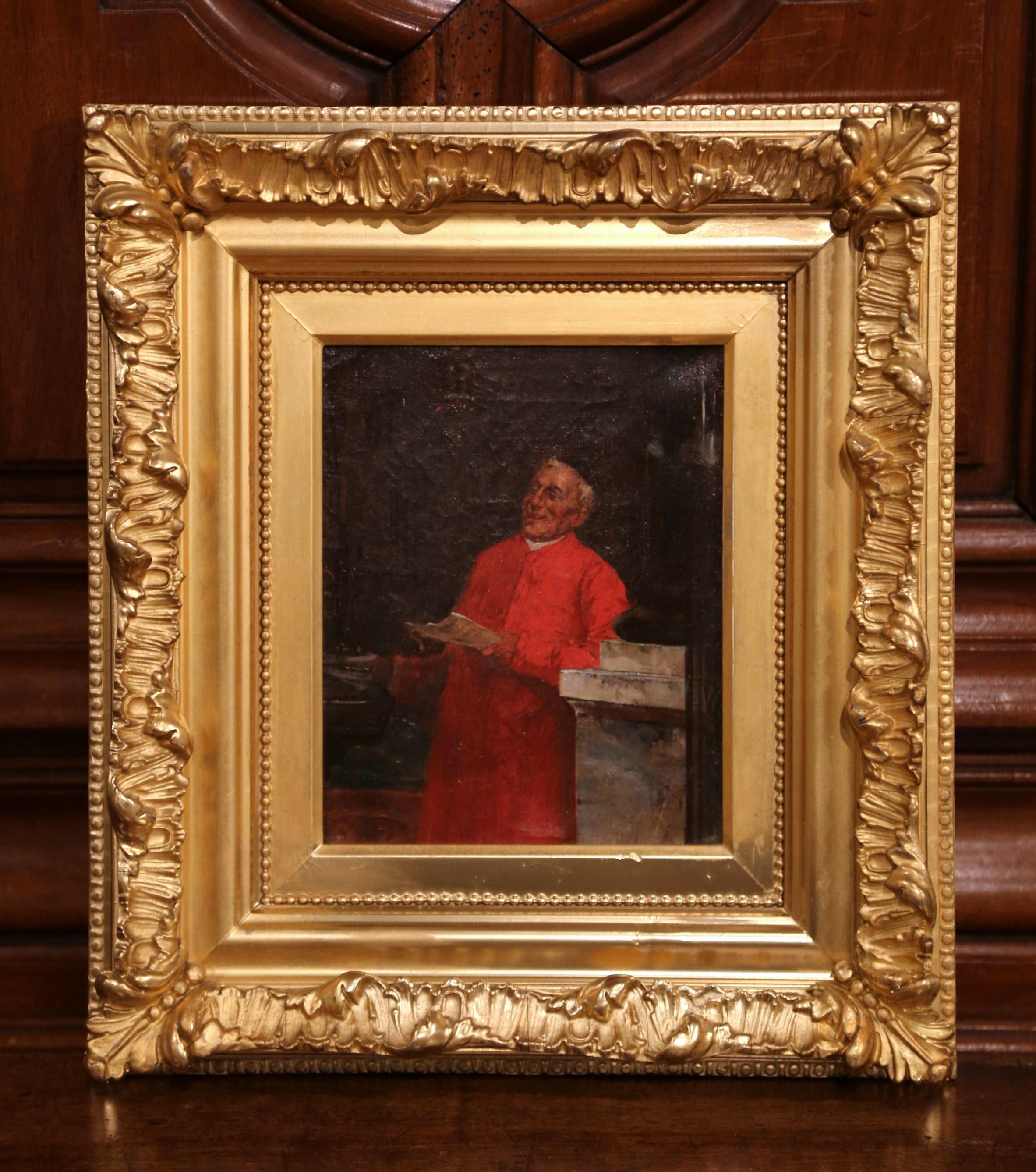 This antique portrait painting was created in France circa 1850. The rectangular artwork is set inside a carved gilt wood frame and depicts a French cardinal dressed in a traditional red cassock. His expression is jovial, he smiles and appears to be