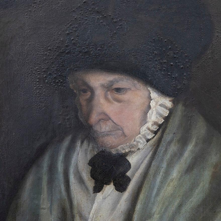 A delightful Victorian portrait of an elderly woman in a darkened interior. She wears a laced cap that attaches under the chin and looks down at the bowl of seashells and book infront of her. The artist brings the viewer's eye to the centre of the