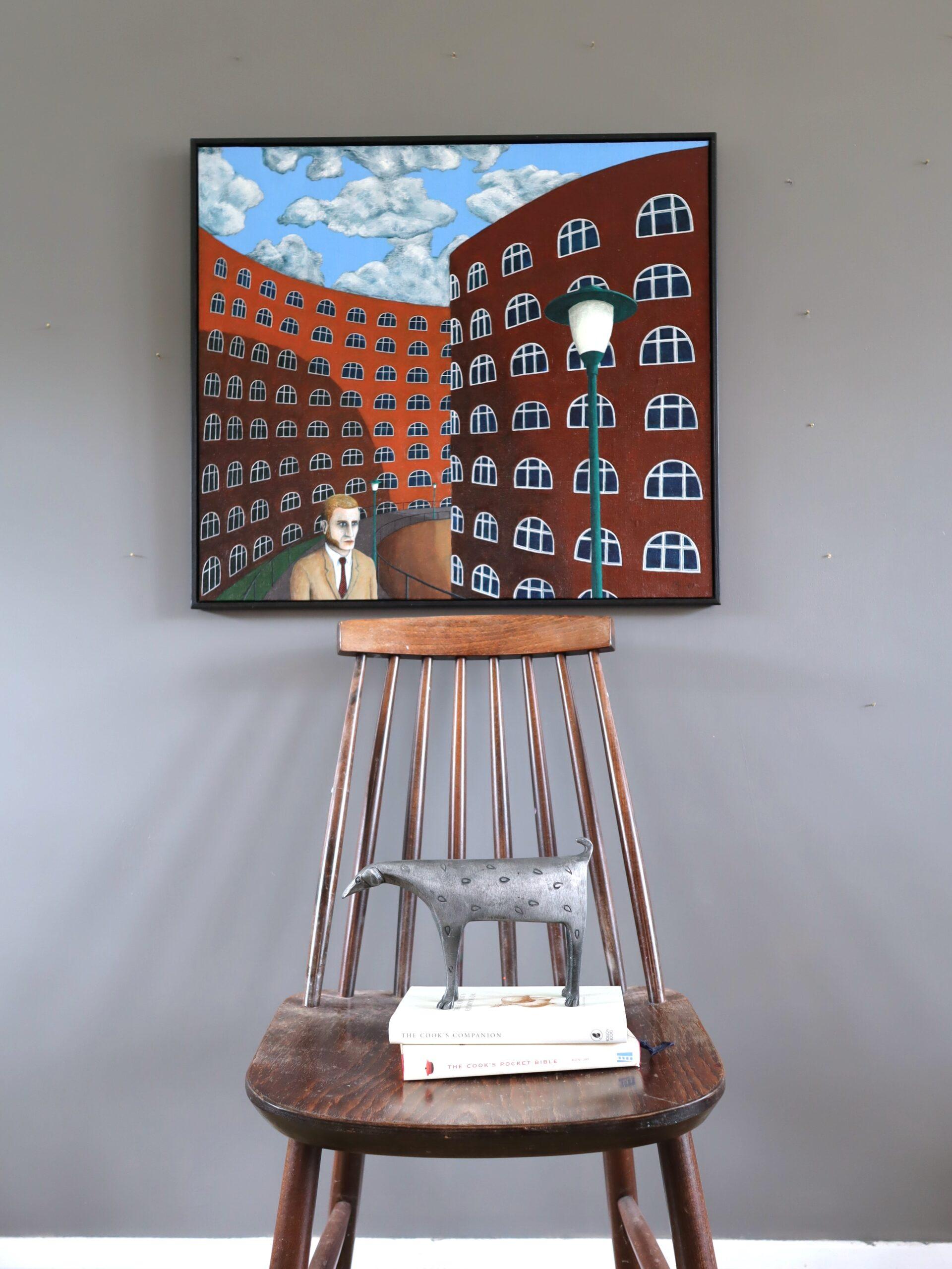 WHEN I DREAM, NO ONE IS HOME
Size: 57 x 63 cm (including frame)
Oil on board

A captivating and enigmatic urban dreamscape painted in a surrealist style, executed in oil onto board and dated 2007.

The painting unfolds where rows of identical arched