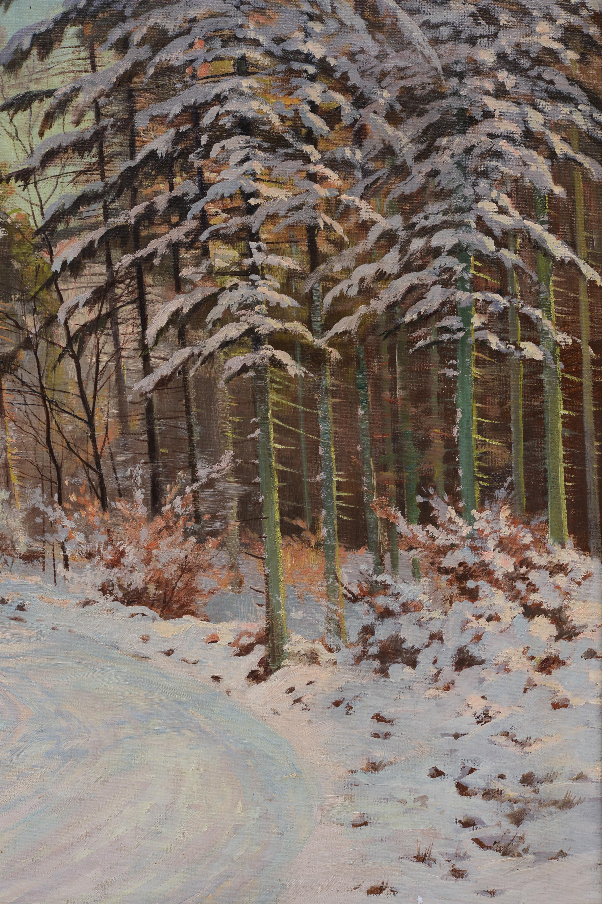 This original oil on canvas from the first half of the 20th century presents a quiet Scandinavian winter landscape. A winter road winds between open fields and dense forest wrapped in a white snowy coat, turning toward a small village hamlet visible